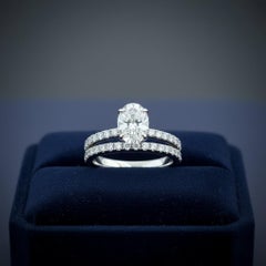 Harry Winston Oval Diamond Engagement Ring & Pave Wedding Band Set