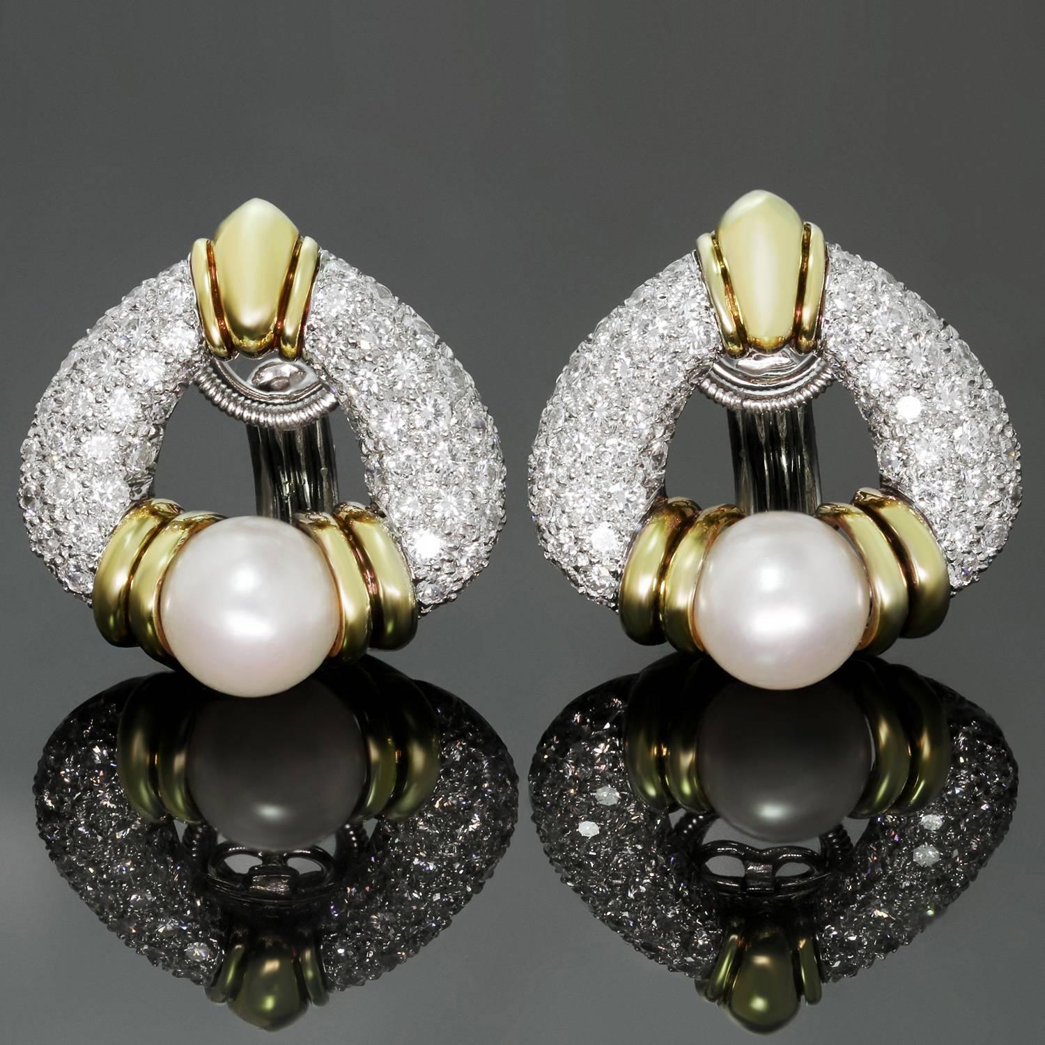 These stunning Harry Winston earrings are crafted in platinum with 18k yellow gold accents and set with cultured pearls and sparkling brilliant-cut round diamonds of an estimated 3.0 carats. These  earrings feature fabulous rotatable clip-on backs