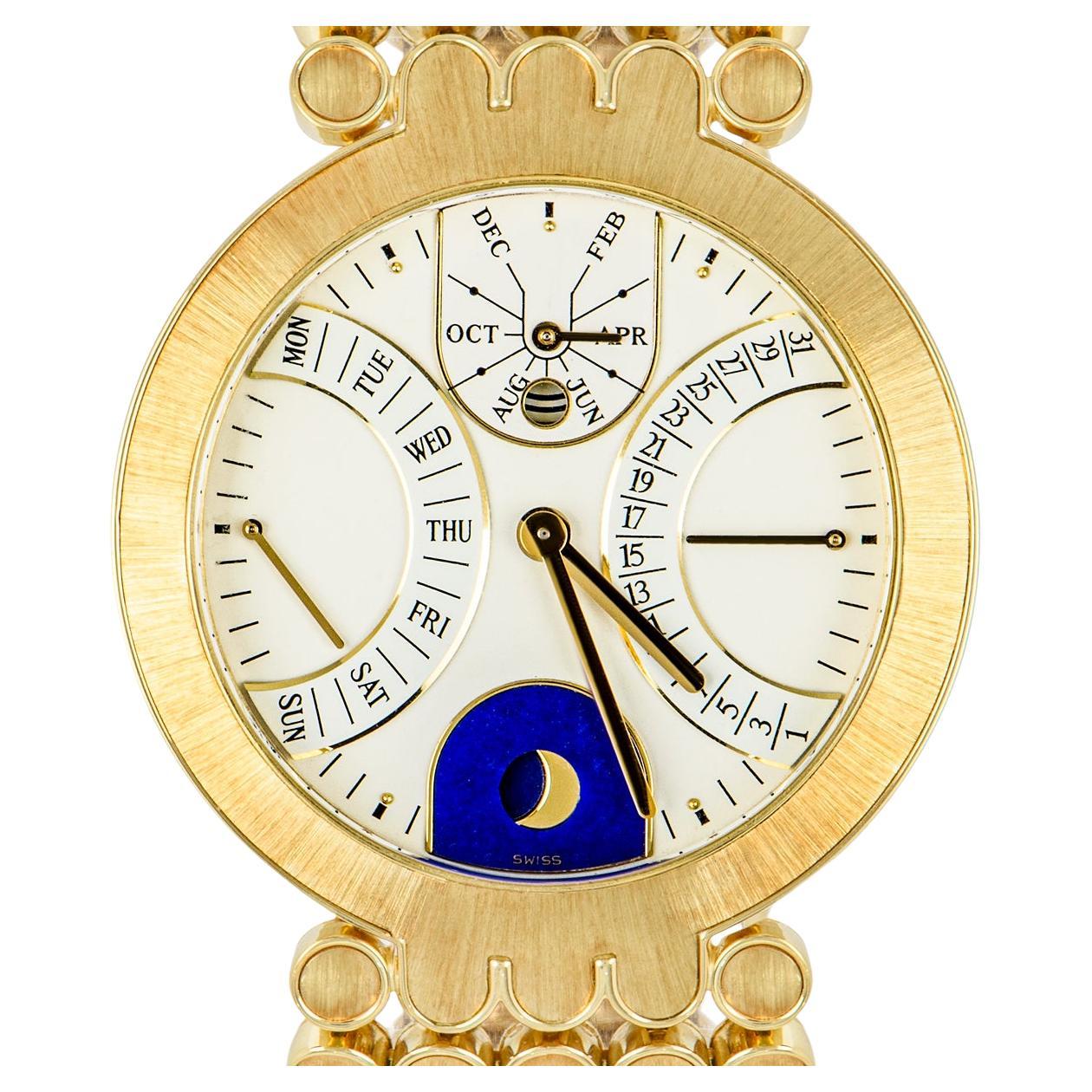 An 18k yellow gold Perpetual Calendar Retrograde wristwatch. Featuring a white enamel dial with a date display, weekday indicator, a moon phase aperture as well as a month and leap year indicator. The watch is fitted with a sapphire glass, a