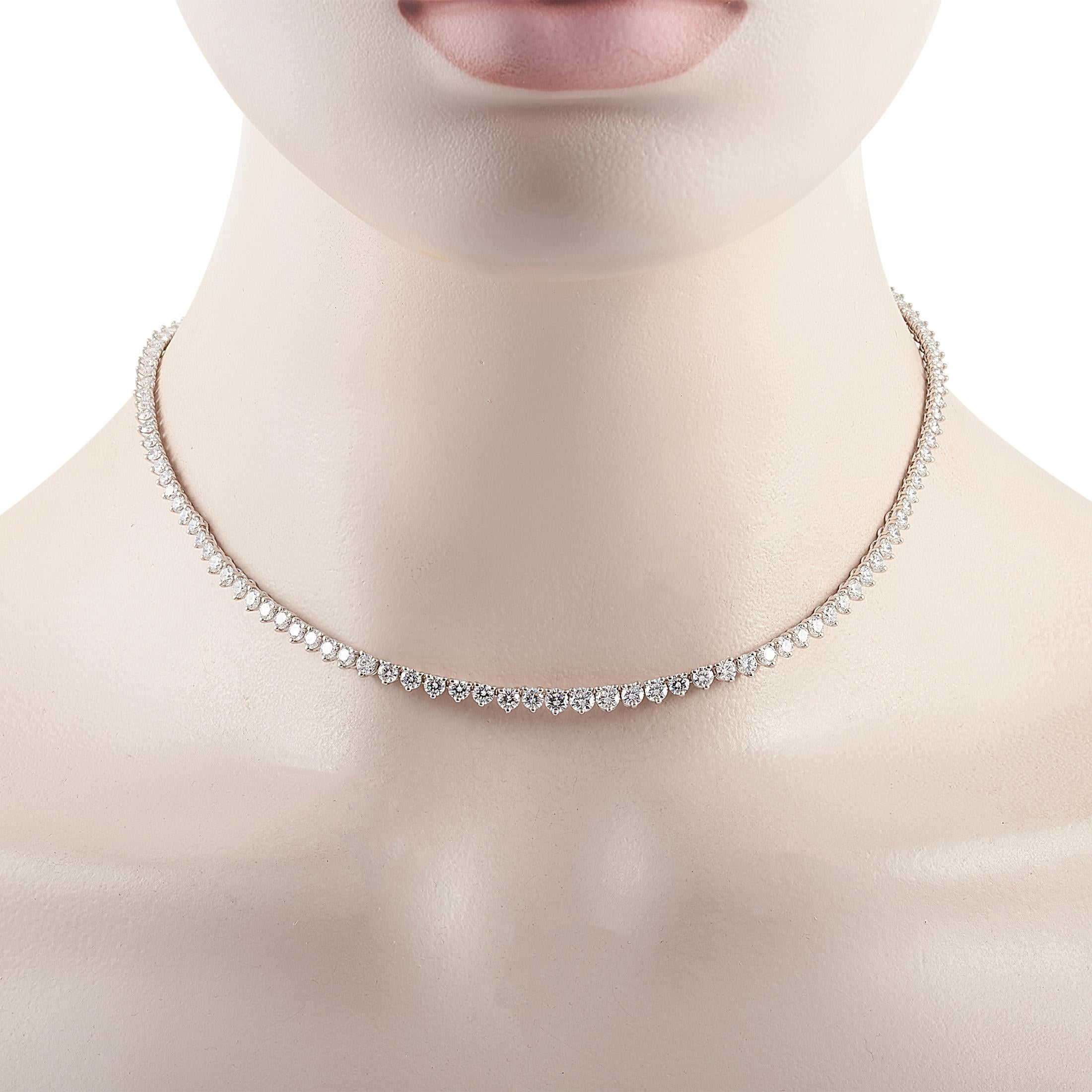 This Harry Winston rivière necklace is crafted from platinum and weighs 25 grams, measuring 15.50” in length. The necklace is set with diamonds that boast E color and VVS clarity and total 12.00 carats.

Offered in estate condition, this jewelry