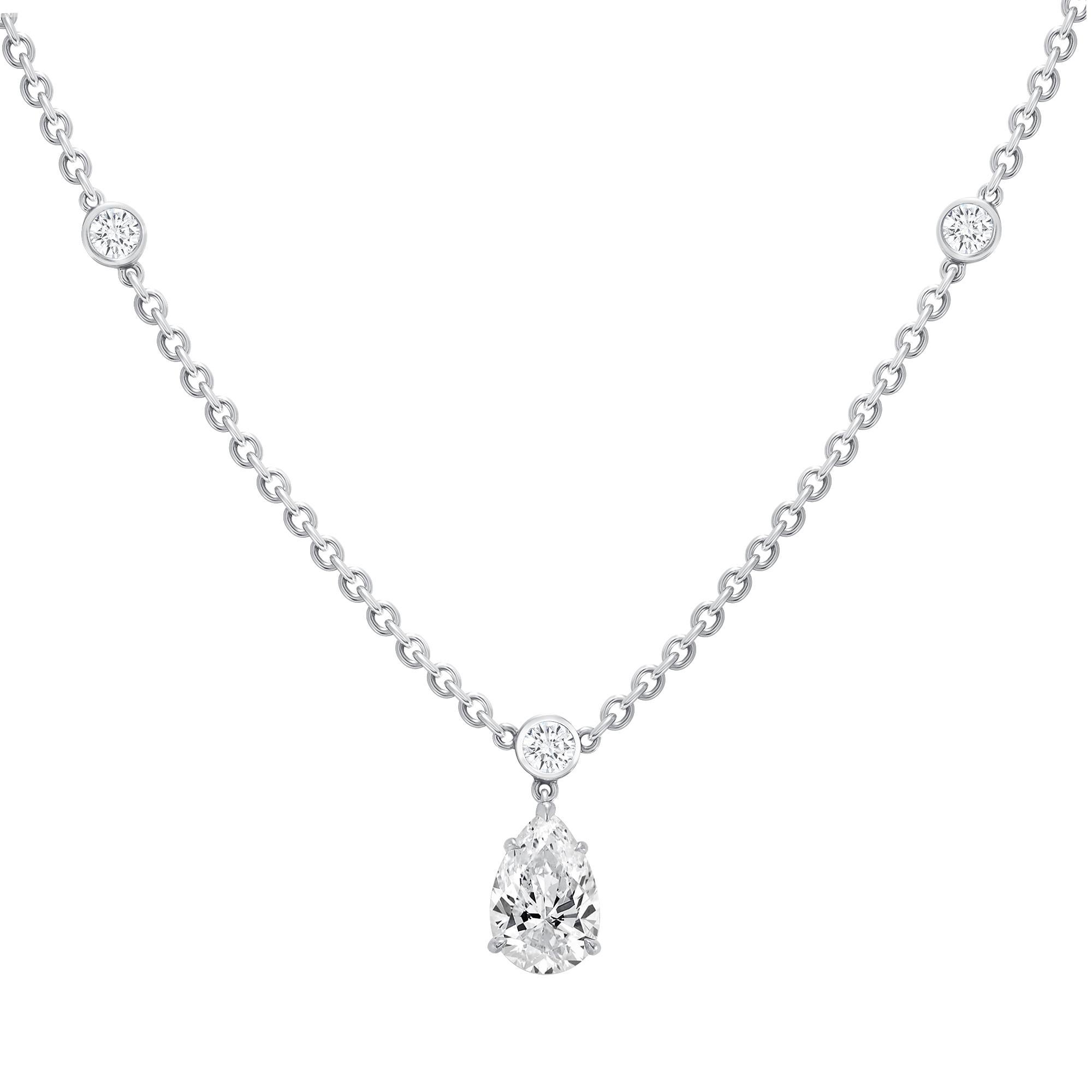 Harry Winston Platinum Pear Shape Diamond Center Diamond By Yard Necklace
8.7 Grams 
1.52 Carat Pear Shape Diamond 
Color: F 
Clarity: VS1
9 Round White Brilliant Cut Diamonds 0.86 Carats Total Weight
Color: D-F
Clarity:Vs2+

This is a timeless