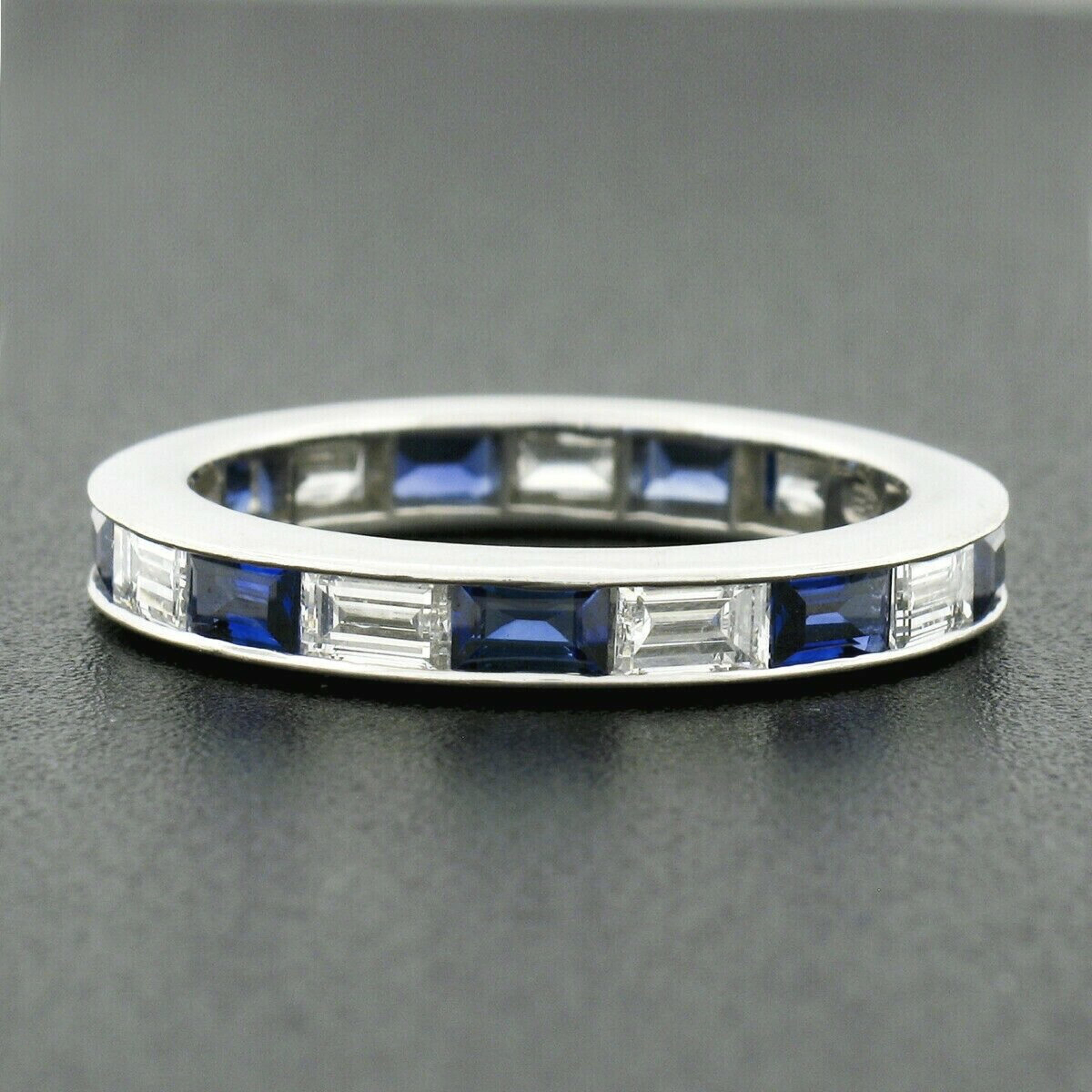 This is a truly magnificent Harry Winston eternity band ring that is crafted in solid platinum and features the finest sapphires and diamonds that are neatly channel set alternating entirely throughout the band. These stunning stones total exactly
