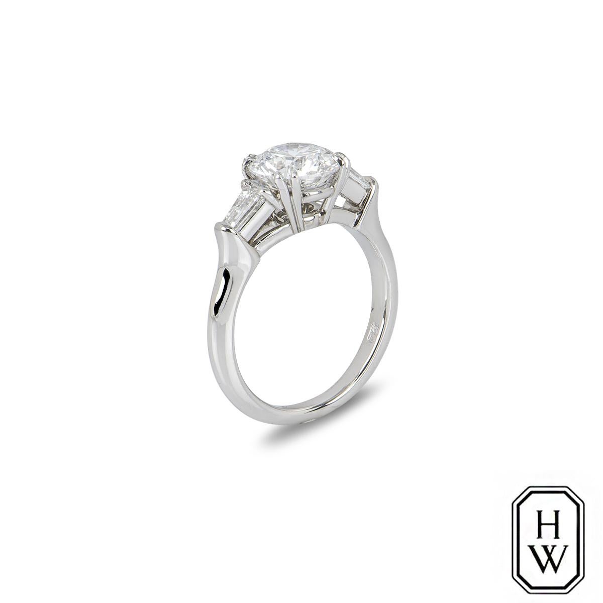 classic winston cushion-cut engagement ring with tapered baguette side stones