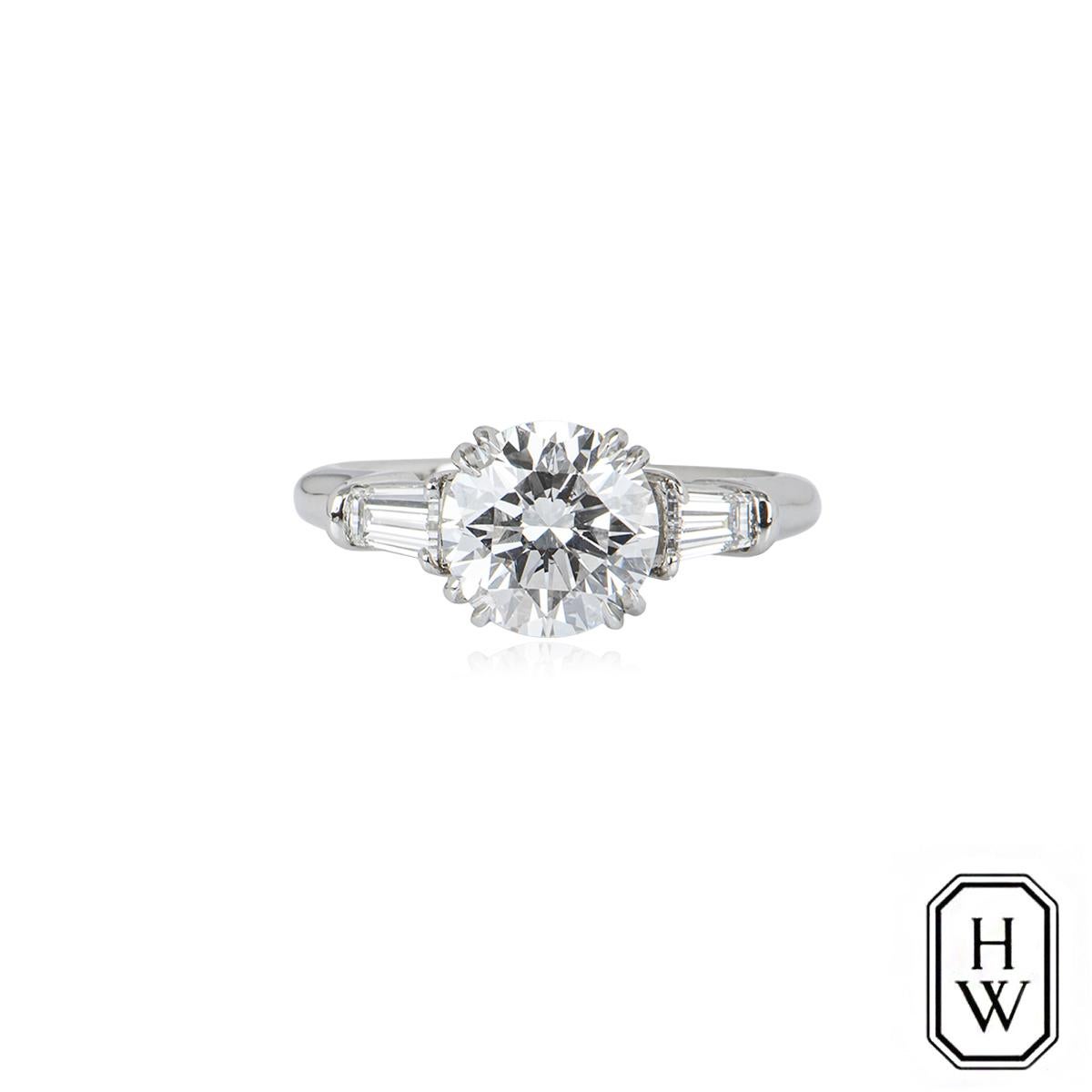 classic winston round brilliant engagement ring with tapered baguette side stones