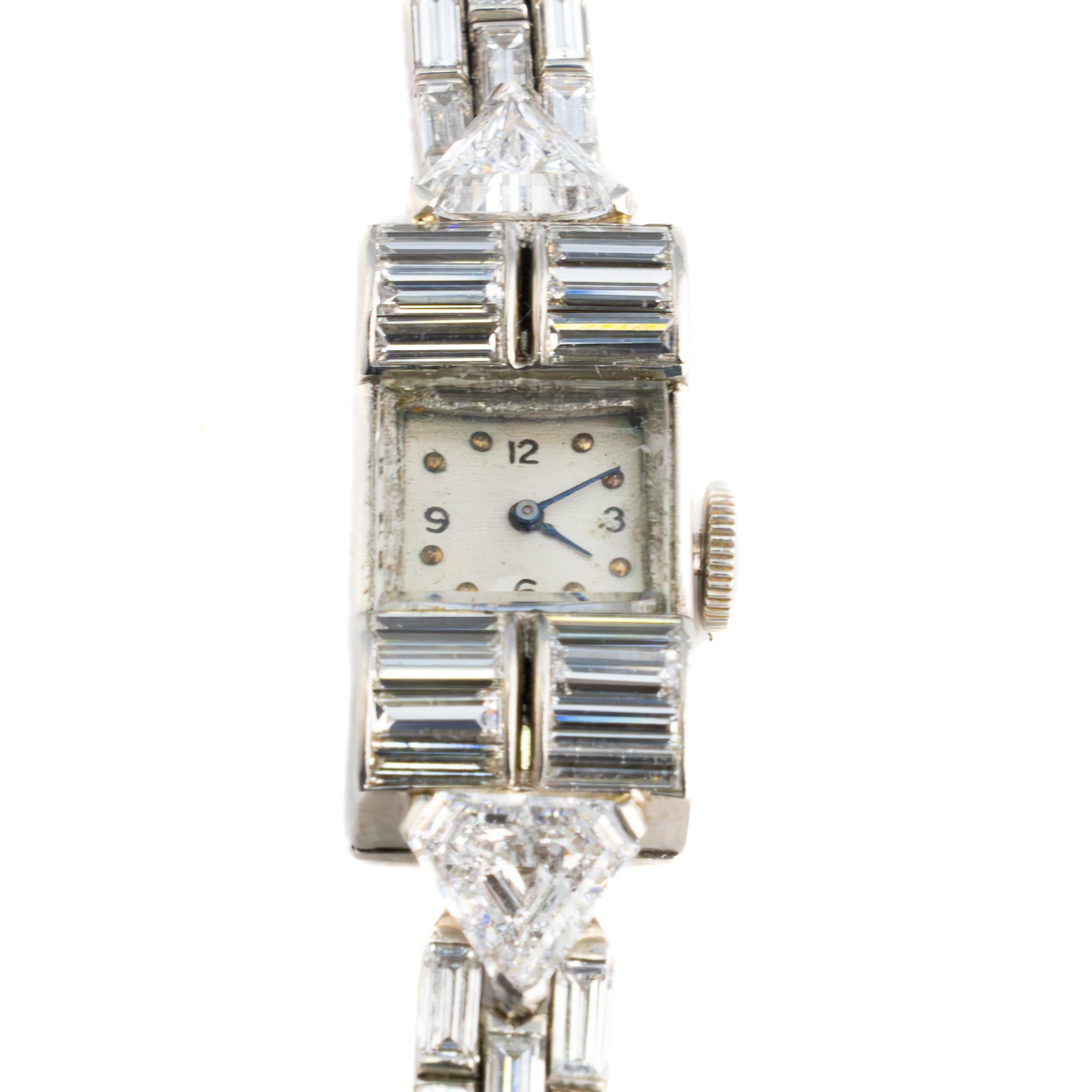 Harry Winston Platinum Diamond Cocktail Watch with Audemars Piguet Movement

Description:
An exceptional vintage diamond cocktail watch by Harry Winston, featuring refined Art Deco styling and exquisite craftsmanship. The platinum case and bracelet