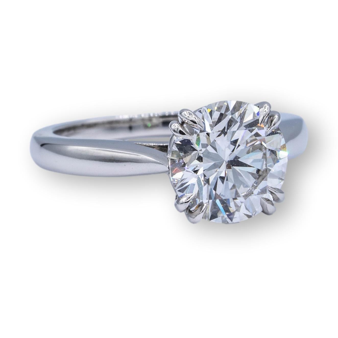 Harry Winston Solitaire Diamond Engagement ring finely crafted in platinum with a fine GIA Certified round center diamond set in double claw prongs weighing 1.61 cts. F color VS1 clarity . Excellent cut, polish and symmetry.  This Harry Winston ring