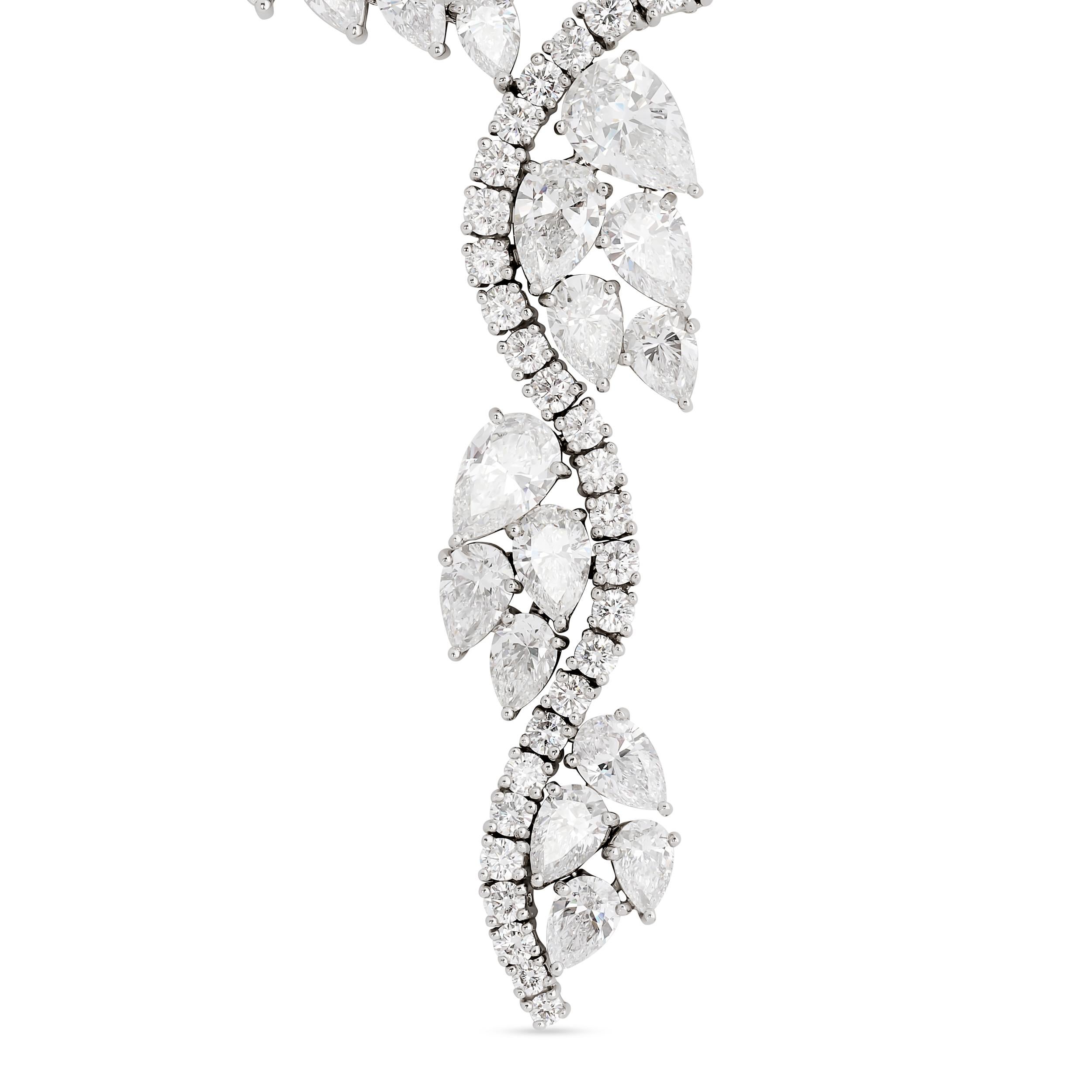 This elegant Harry Winston necklace features a classic line of brilliant-cut diamonds, culminating in a graceful cascade of larger pear-shaped and marquise diamonds that form a captivating, organic motif.

There is approximately 25.04 total carats