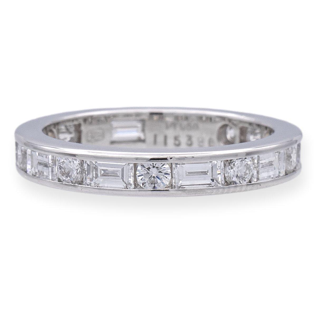 Vintage Harry Winston Wedding Band Ring finely crafted in platinum, this exquisite piece features a continuous pattern of alternating round and straight baguette diamonds in a seamless channel setting, with a total of 10 straight baguette diamonds
