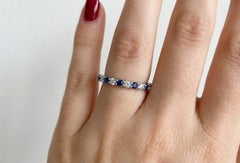 Harry Winston Platinum Eternity Wedding Band with Round Diamonds and B. Sapphire