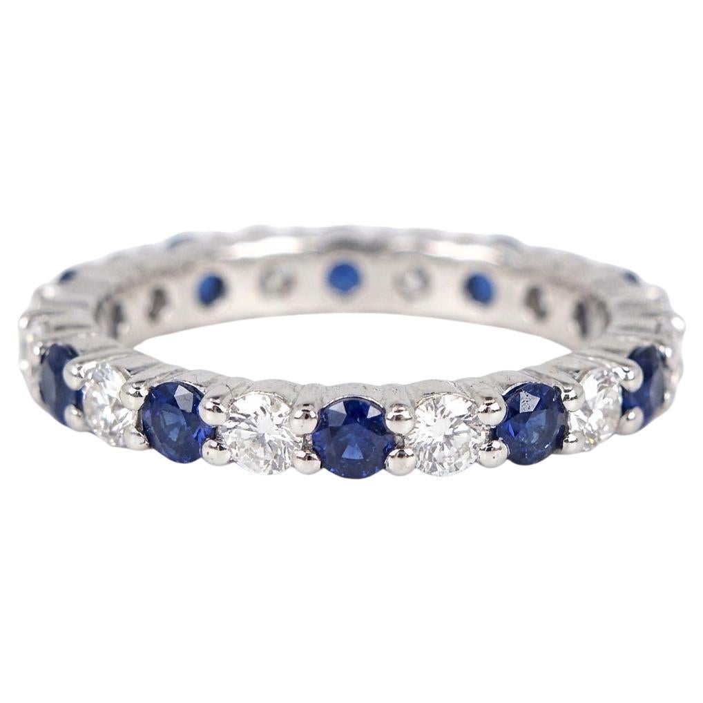 Harry Winston Platinum Eternity Wedding Band with Round Diamonds and B. Sapphire For Sale