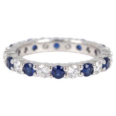 Harry Winston Platinum Eternity Wedding Band with Round Diamonds and B. Sapphire