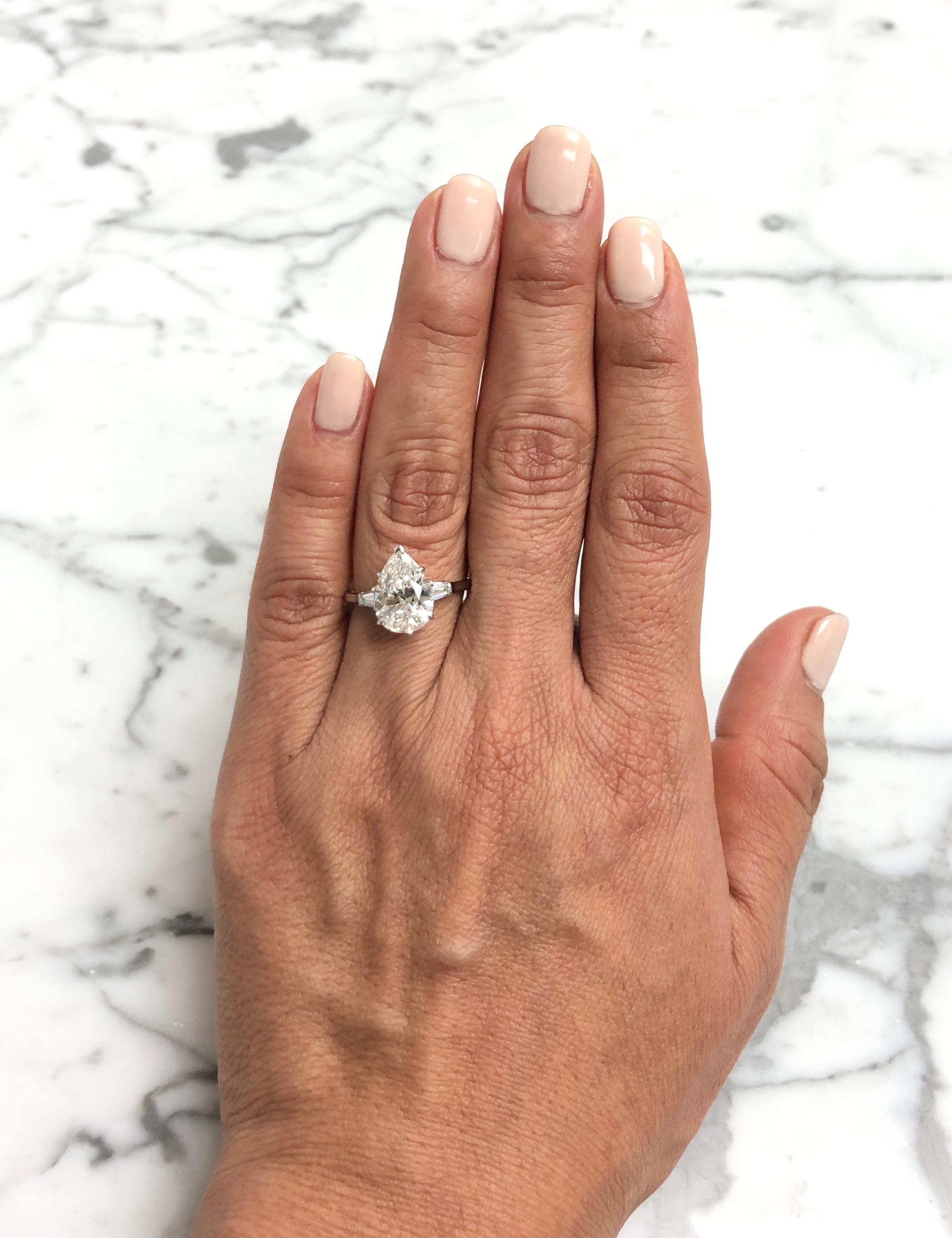 Women's Harry Winston Platinum Pear Shape Diamond Engagement Ring with Baguettes Circa 1