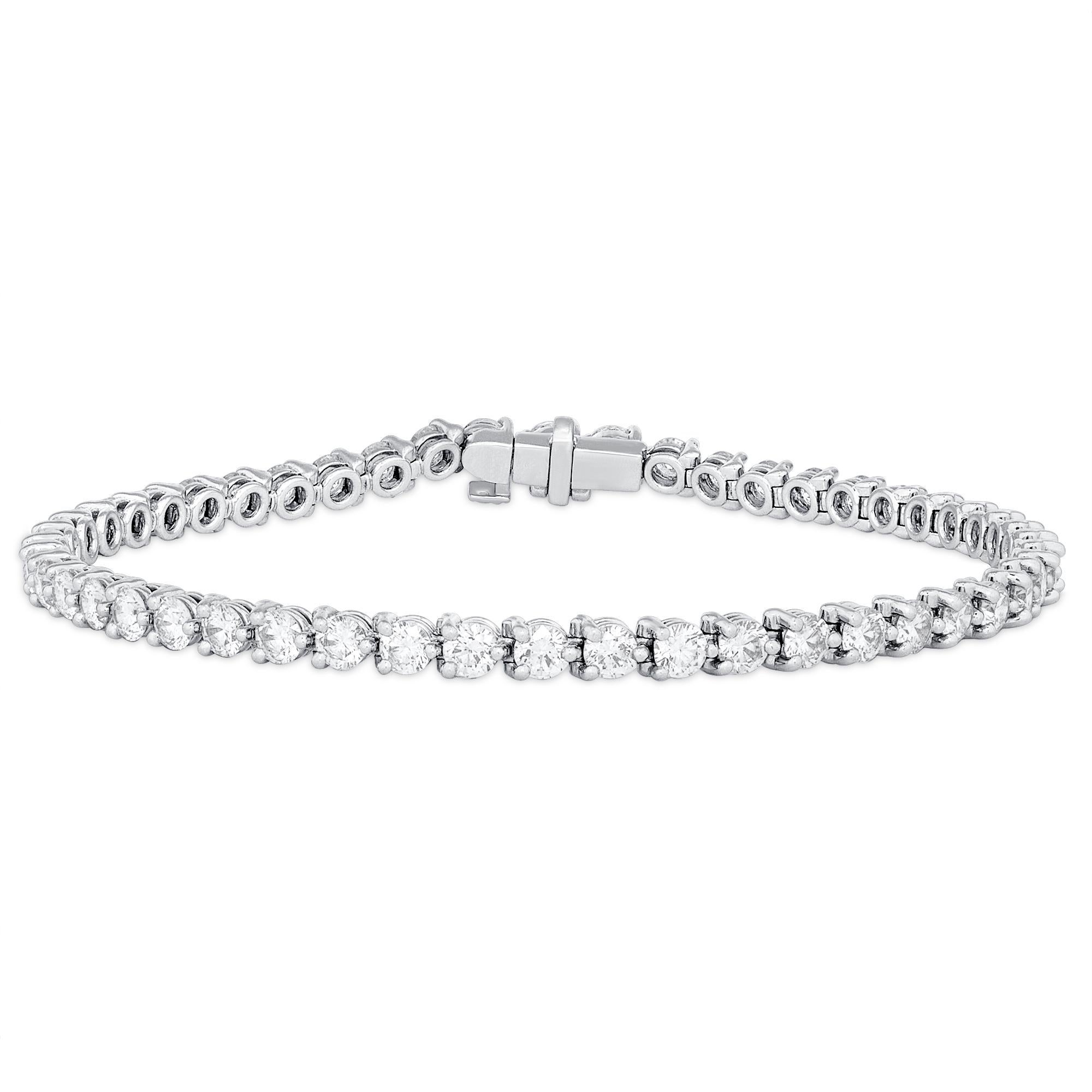 Harry Winston Platinum Round White Diamond Tennis Bracelet 
13 Grams 
50 Round White Diamonds 4.84 Carats Total Weight
Color: D-F 
Clarity: VS2+

This is a timeless Harry Winston Tennis bracelet. The diamonds are all white and bright, perfect