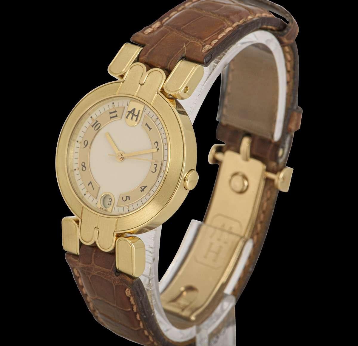 A 30 mm 18k Yellow Gold Premier Automatic Date Ladies Wristwatch, silver dial with arabic numbers, date at 6 0'clock, a fixed 18k yellow gold bezel, an original brown leather strap with an original 18k yellow gold deployant clasp, sapphire glass,