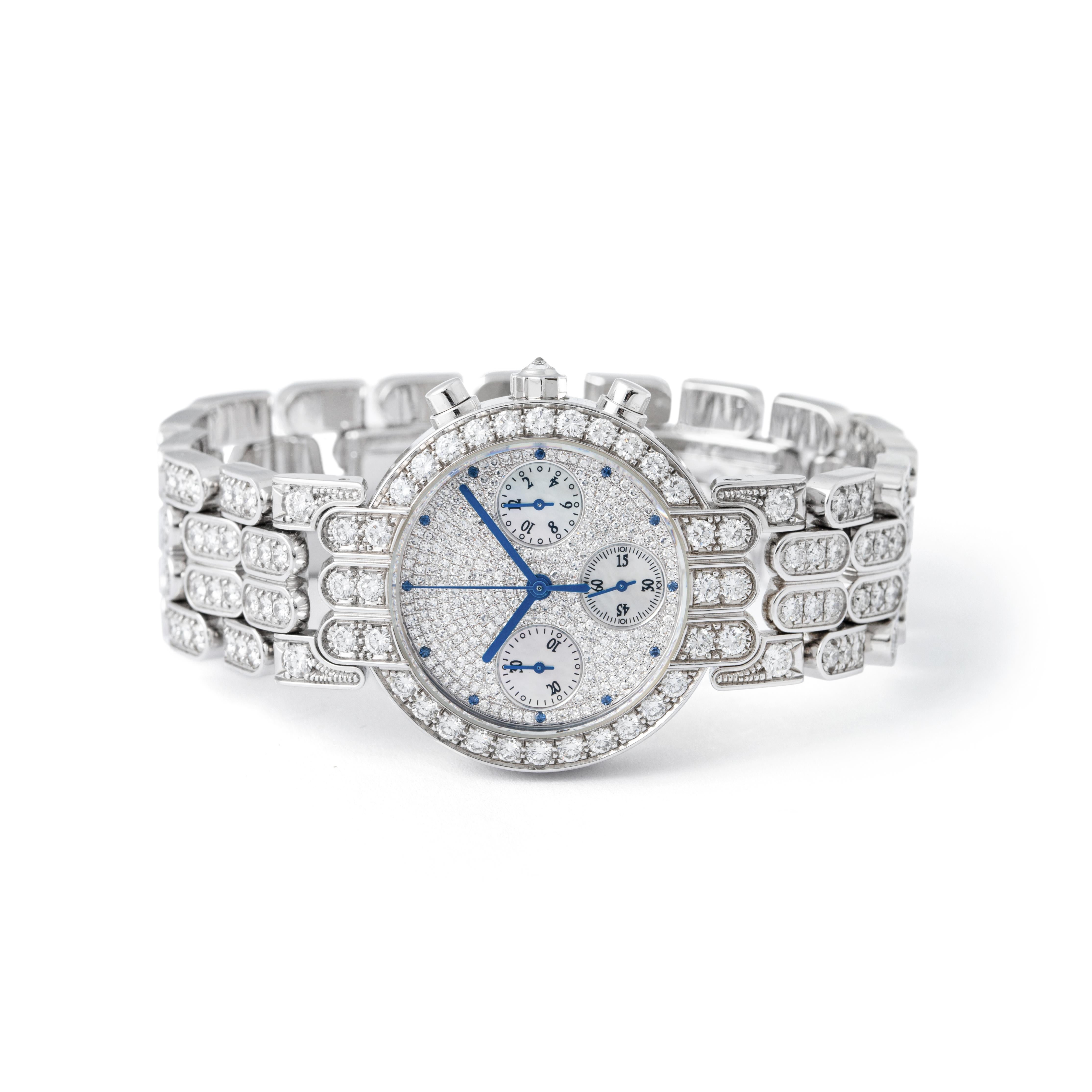 Solid 18kt white gold case & bracelet with a polished finish.
The case, bezel, lugs & bracelet are pave set with diamonds.
The crown is set with a single rose cut diamond.
Total diamond weight - approximately 9.45 carats.
Dial:
Pave set with