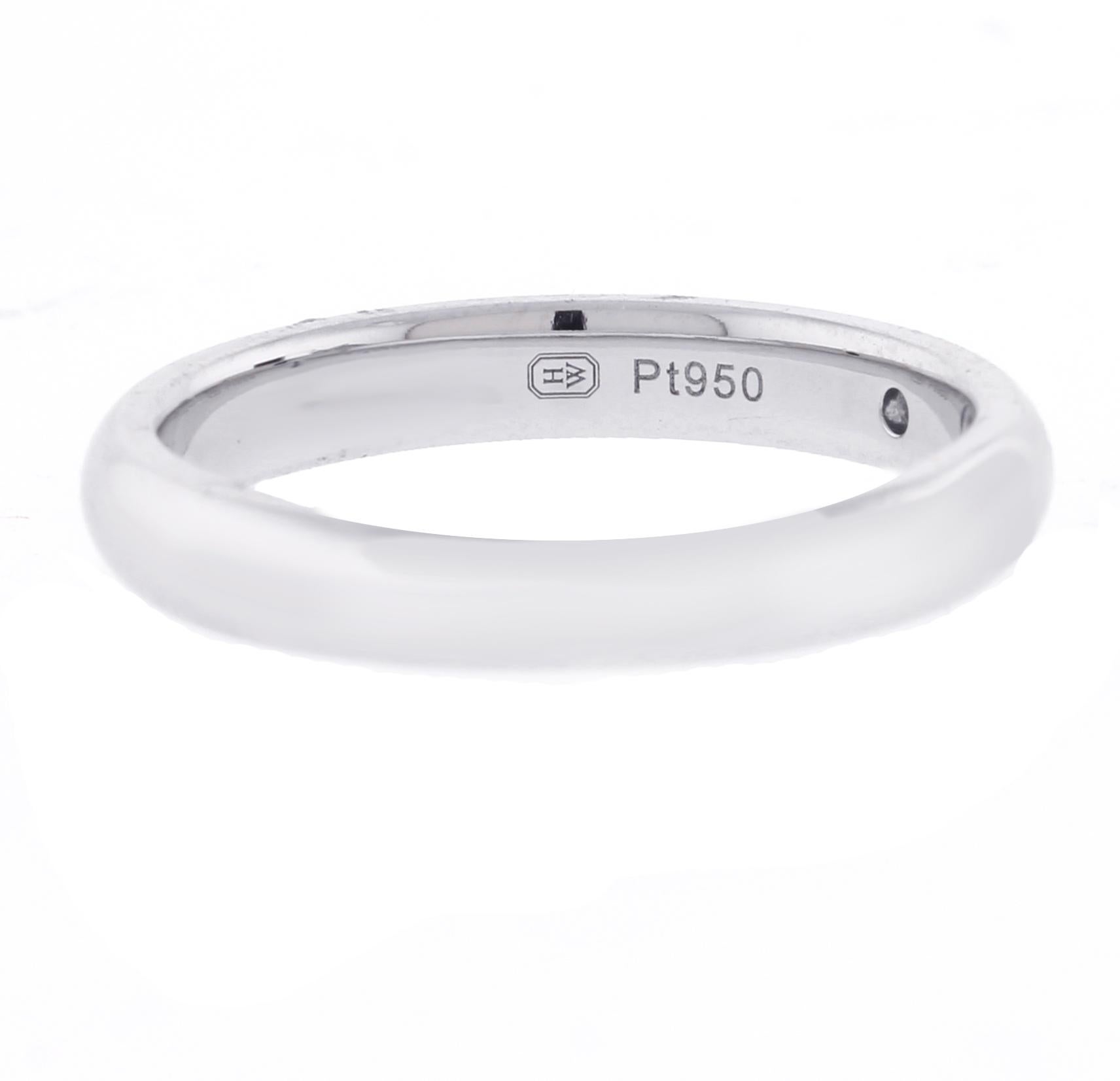 Crafted in platinum, this refined wedding band is accented with a single round brilliant diamond of approximately 0.04 carats. A timeless symbol of devotion, it complements any engagement ring with effortless grace and may also be worn in a modern