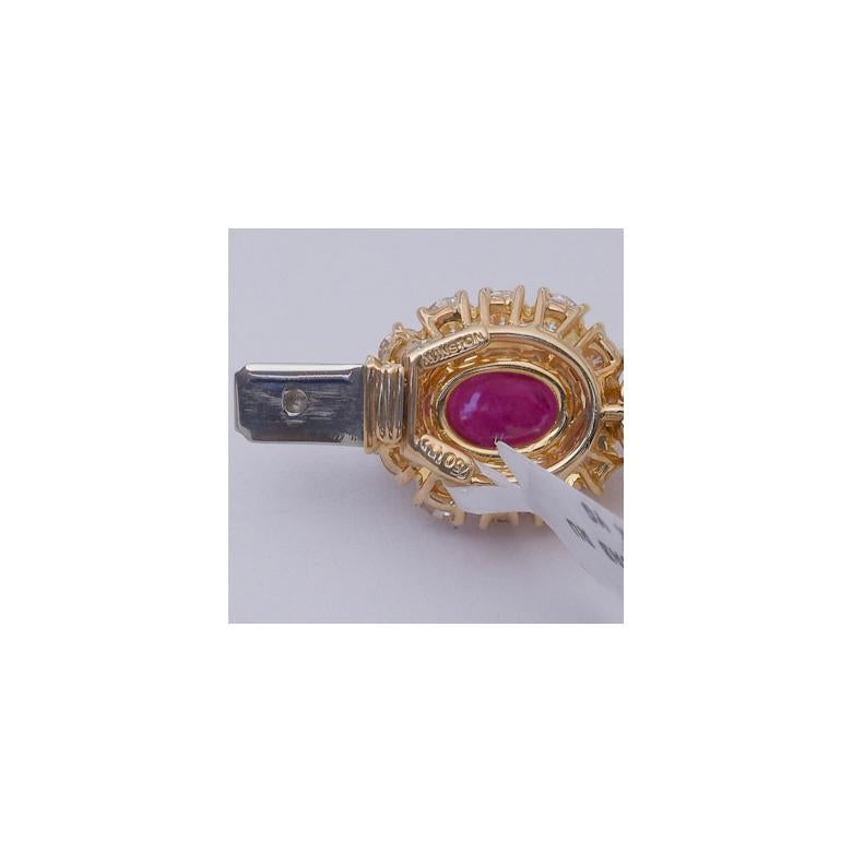 Fine ruby and diamond bracelet, featuring a series of oval-shaped cabochon rubies surrounded by round brilliant-cut diamonds alternating with marquise-shaped and round brilliant-cut diamond clusters, in 18k yellow gold.

Signed 'WINSTON' for Harry