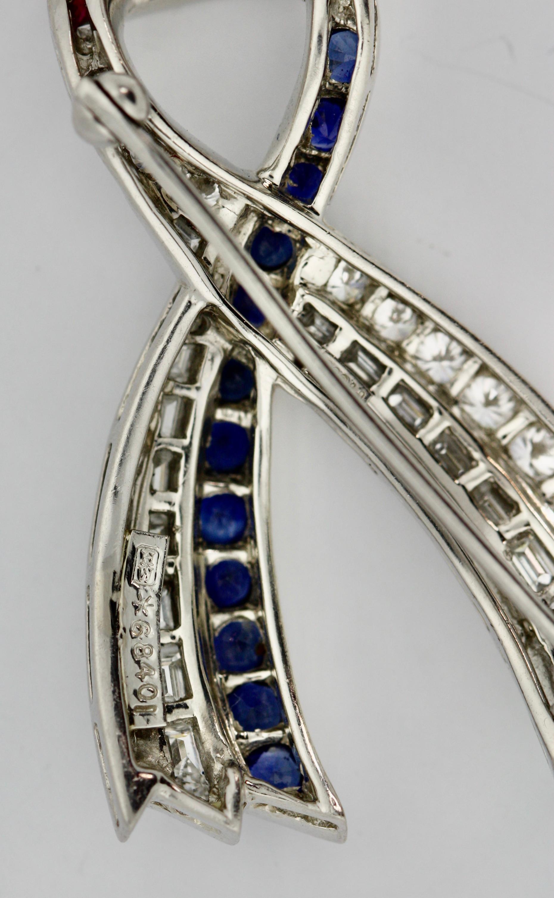 
Harry Winston
Sapphire and Diamond Brooch
mounted in Platinum 
11.7 grams (gross) 
length 1.5 inches; 
