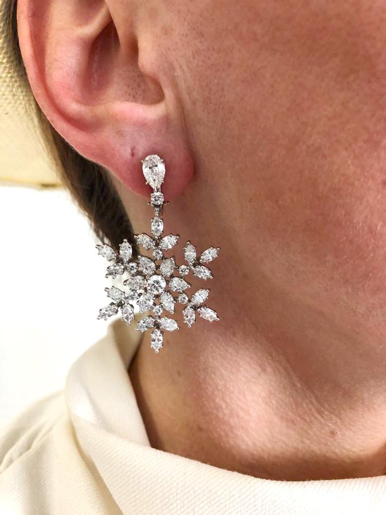 HARRY WINSTON Snowflake Drop Earrings in 18k White Gold and Platinum.

The recognizable Harry Winston Snowflake geometric clusters, with icy needles of marquise and round brilliant diamonds set in a slightly tiered form, suspended from pear-shaped