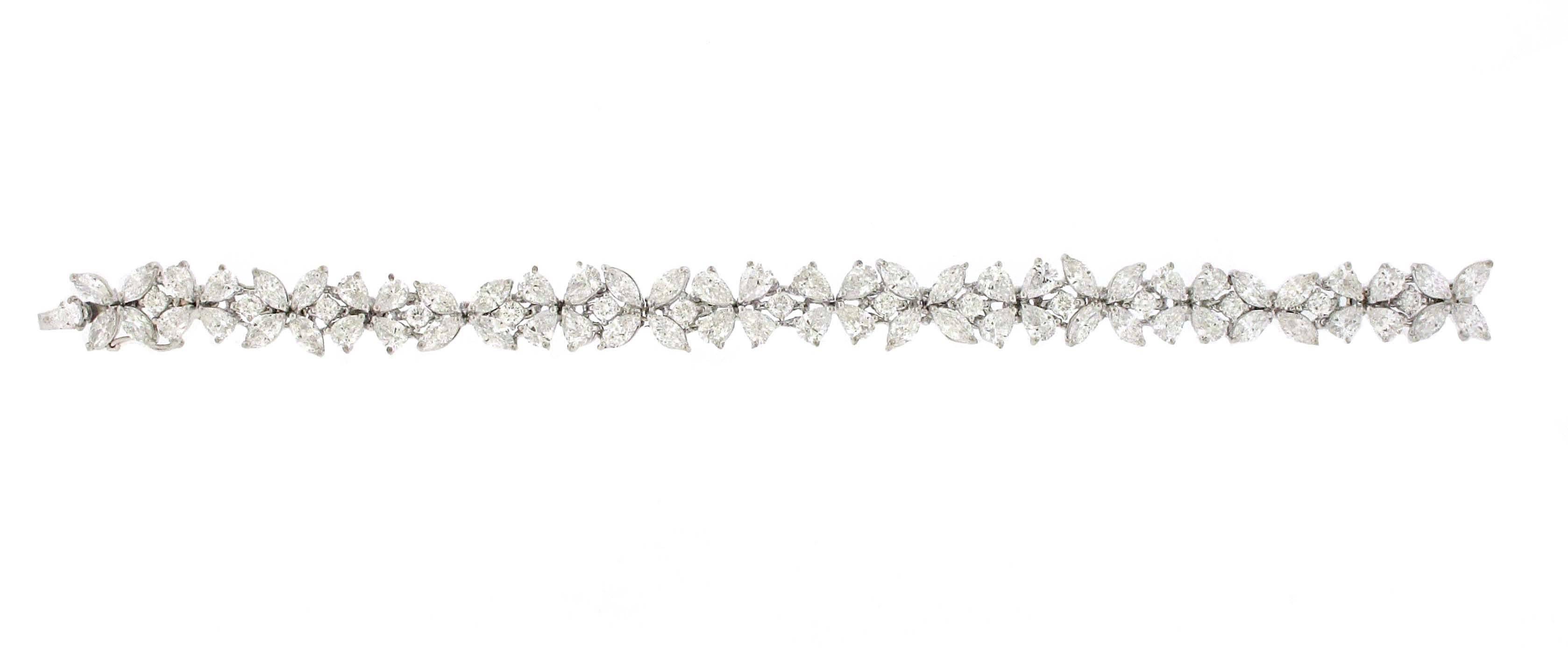 Extremely well made fancy cut diamond bracelet. This is the same style bracelet Harry Winston has become famous for. They are more commonly referred to as cluster flower bracelets. All of the diamonds in this bracelet are of extremely high quality.