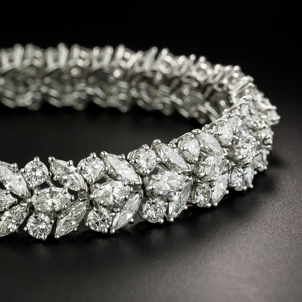 Evoking the elegance and glamour of Golden Age Hollywood jewels, this blazingly beautiful wrist bauble lights up your wrist, and the entire room, with a dazzling array of marquise and round brilliant-cut diamonds, all together weighing 19.50 carats.