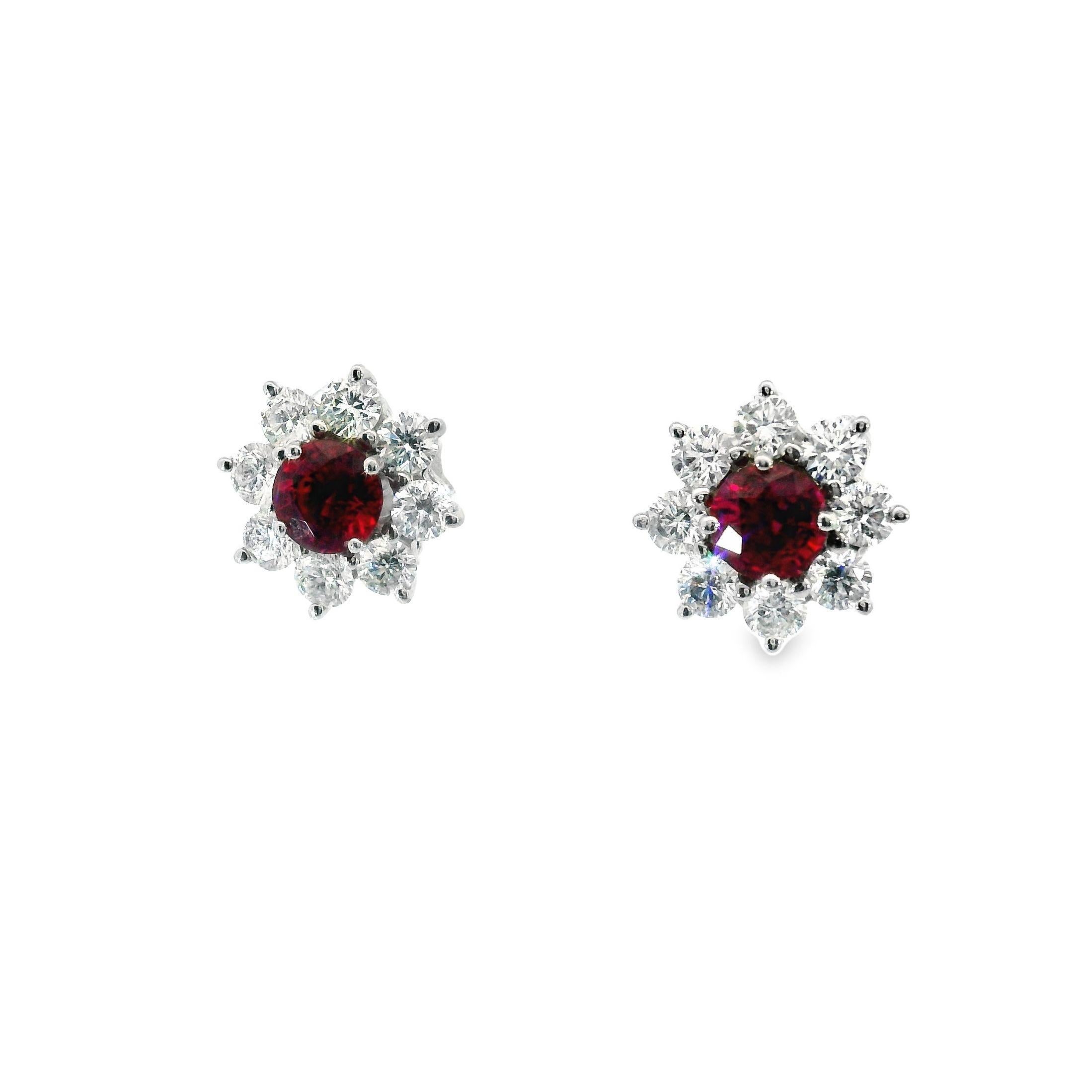 Presenting elegant Harry Winston Sunflower Petite Ruby and Diamond Platinum Earrings, retailing at $18,300 currently. Crafted in platinum, these earrings feature a vibrant central ruby encircled by brilliant-cut diamonds of the highest quality,