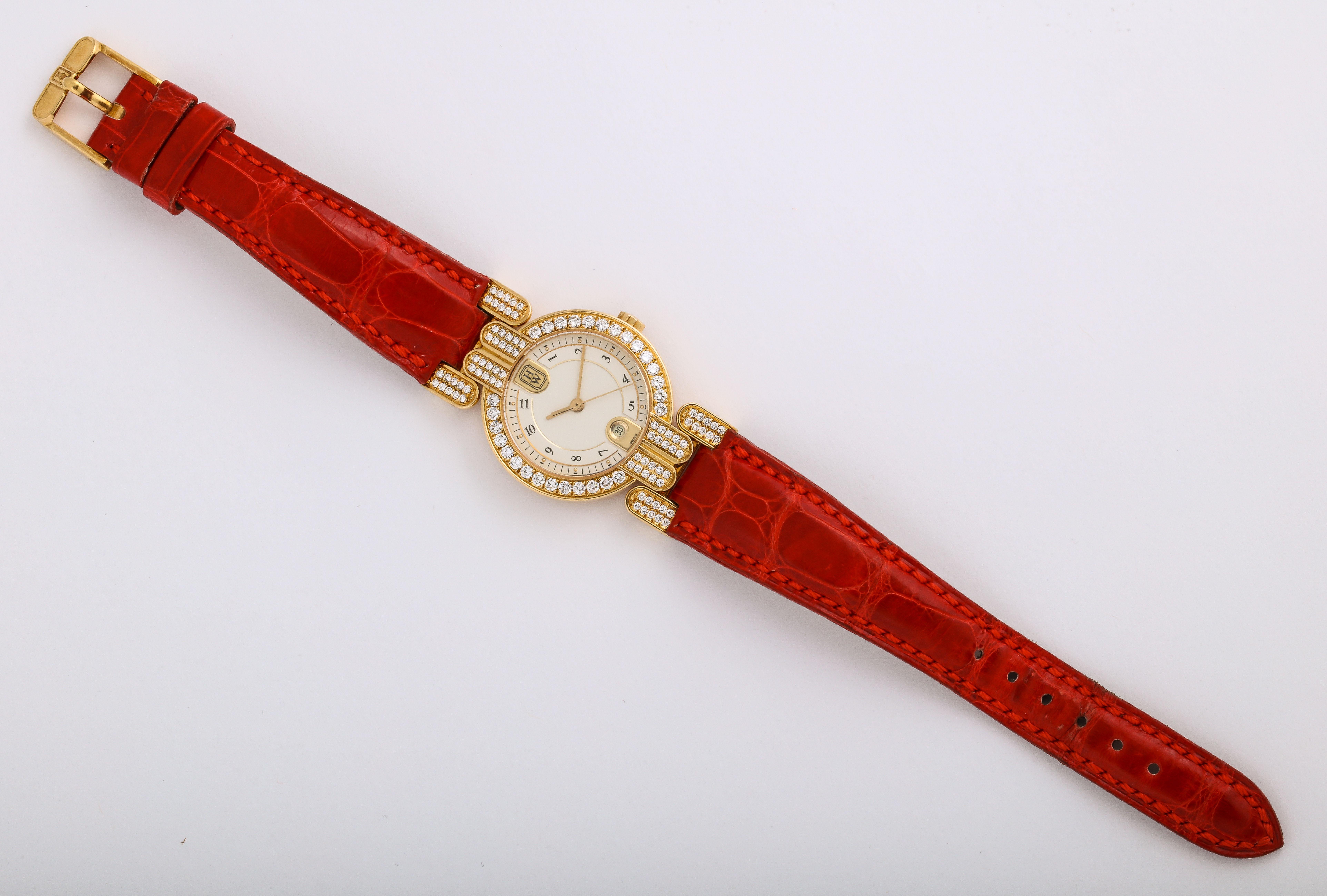 This Harry Winston Yellow Gold Diamond Red Alligator Wristwatch is accompanied by five additional different-colored interchangeable strap sets, making it so very versatile!

Materials:
18k Yellow Gold 
29.4 dwt
Fine white folls @ 1.75 cts TW