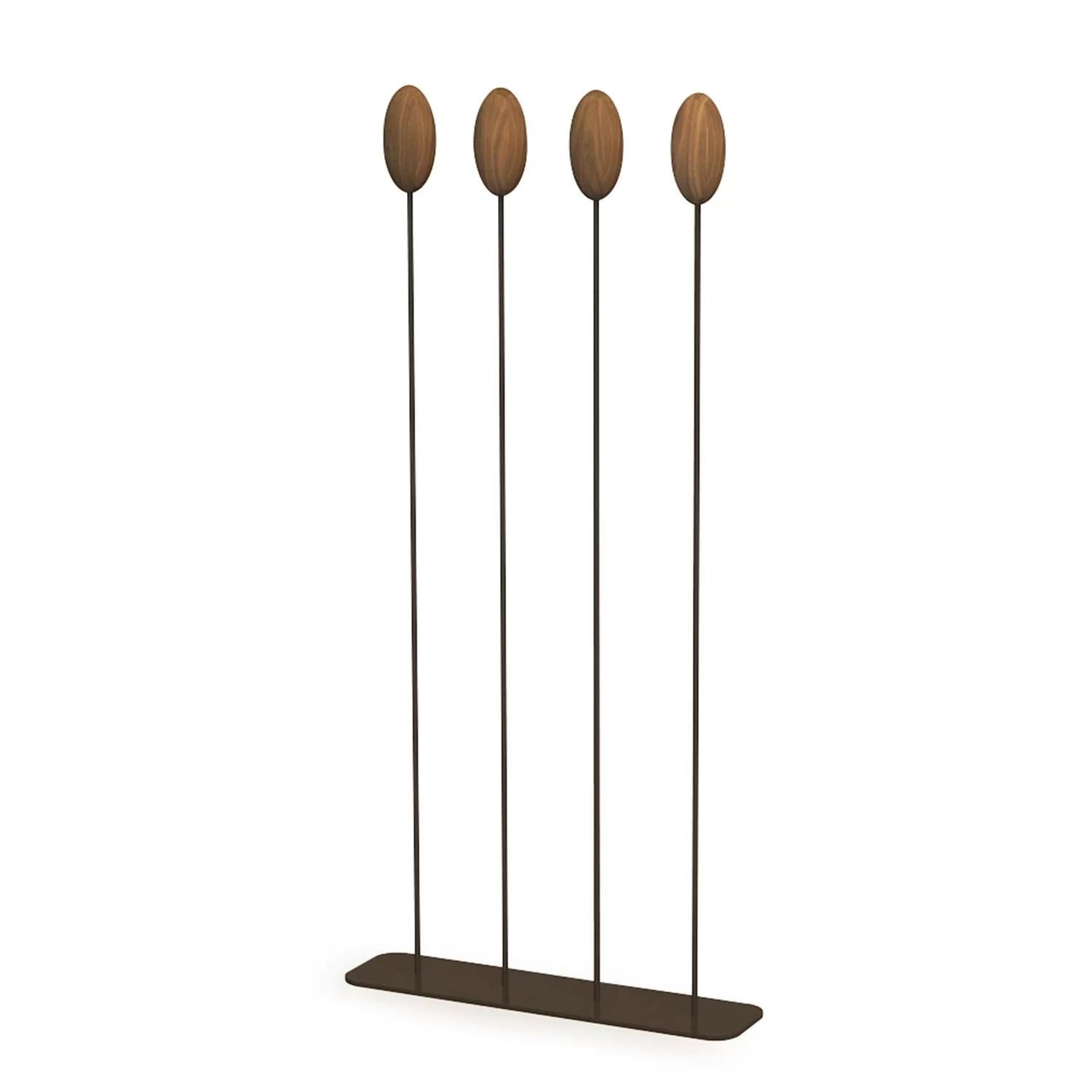 Coat hanger with an iron base and flexibile vertical central supports, topped by an egg made entirely in solid wood with glued slats, replacing the classic hooks. Available in two versions: with square or round base.