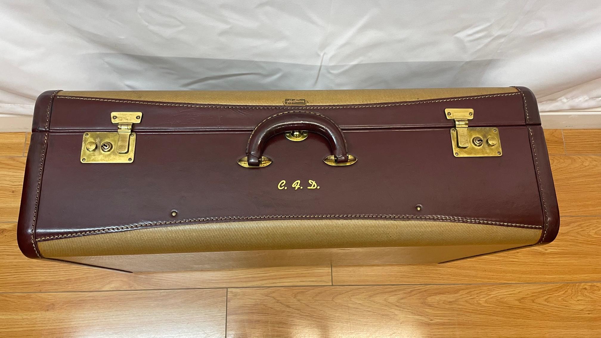 Hartman leather suitcase with original interior and canvas protective case
circa 1940s
22.5