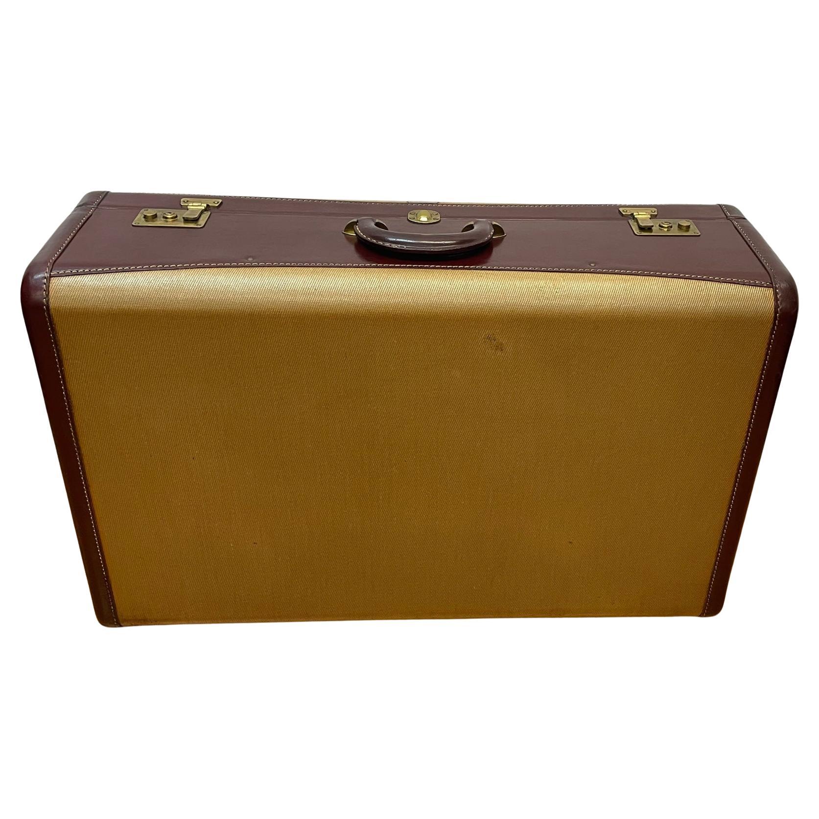 How do you clean an old Hartmann suitcase?