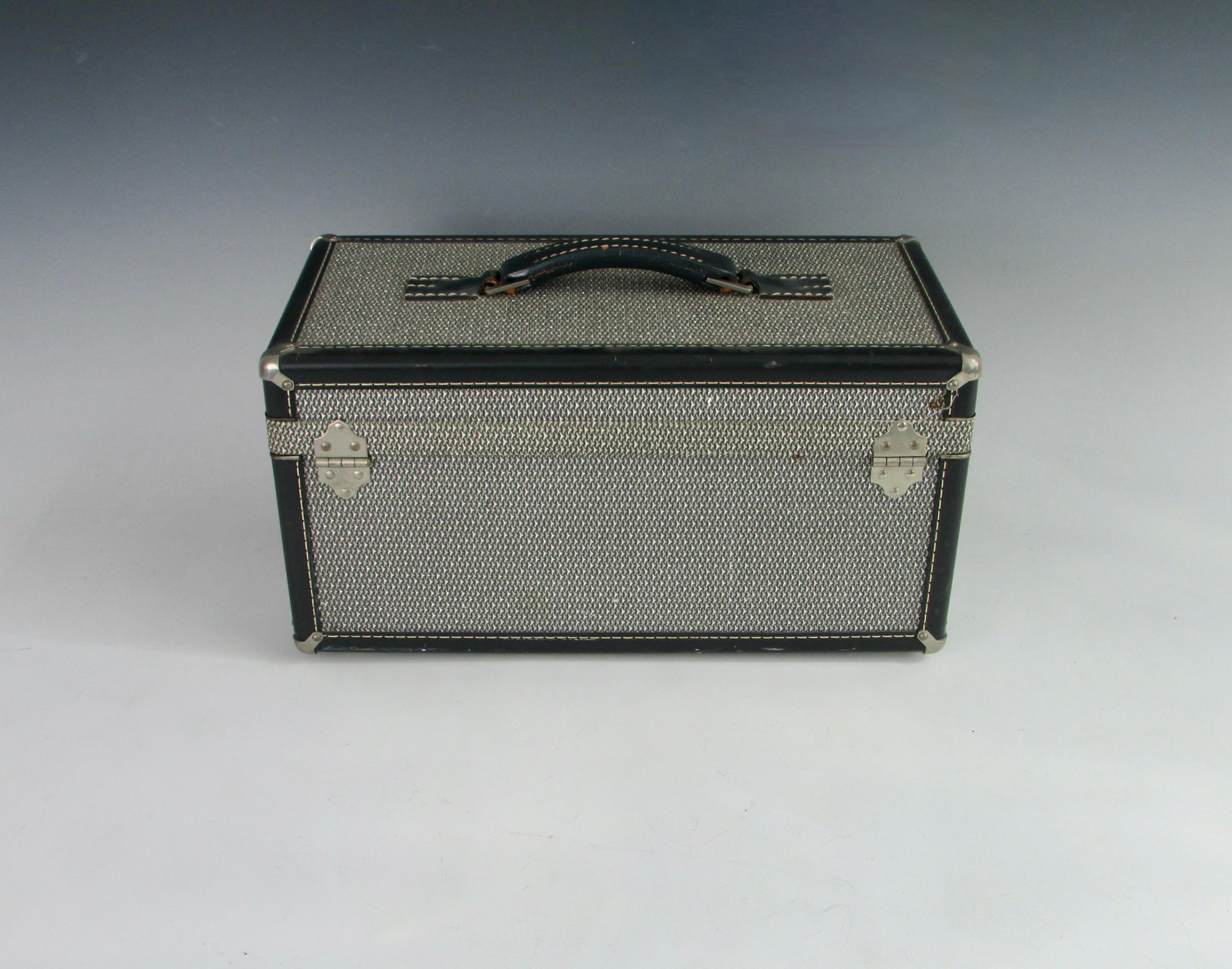 Partially made famous by Ian Fleming by describing James Bond as carrying a Hartman Skymate suitcase in live and let die ca. 1954 . 
Trimmed in leather with nickel plated hardware Hartman is some of the finest luggage available . This mini case can
