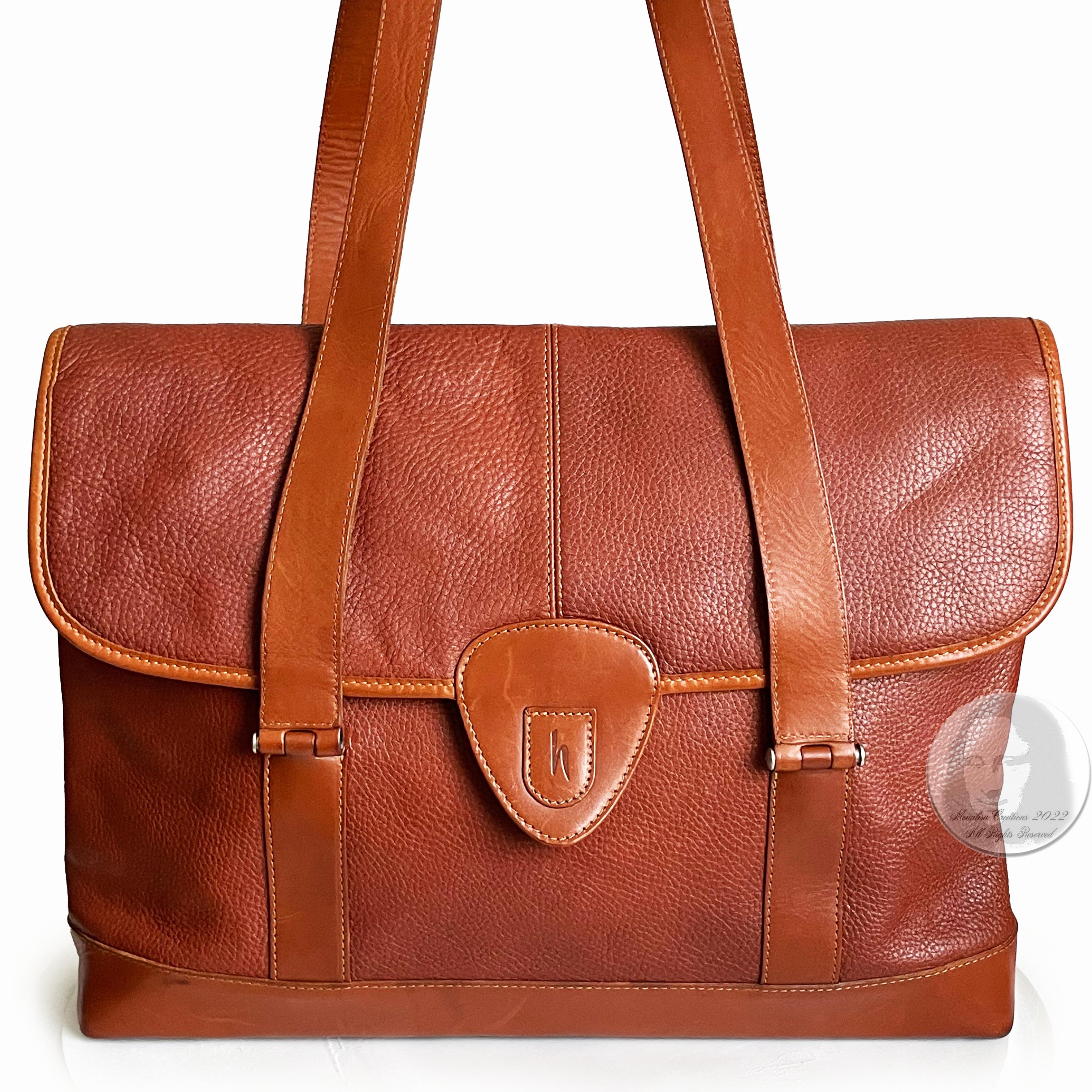 Authentic, preowned, vintage Hartmann business bag soft leather briefcase or computer bag, likely made in the 2000s. Made from a gorgeous pebbled British tan leather, it's trimmed in smooth belting leather and fastens with a snap on the top flap.