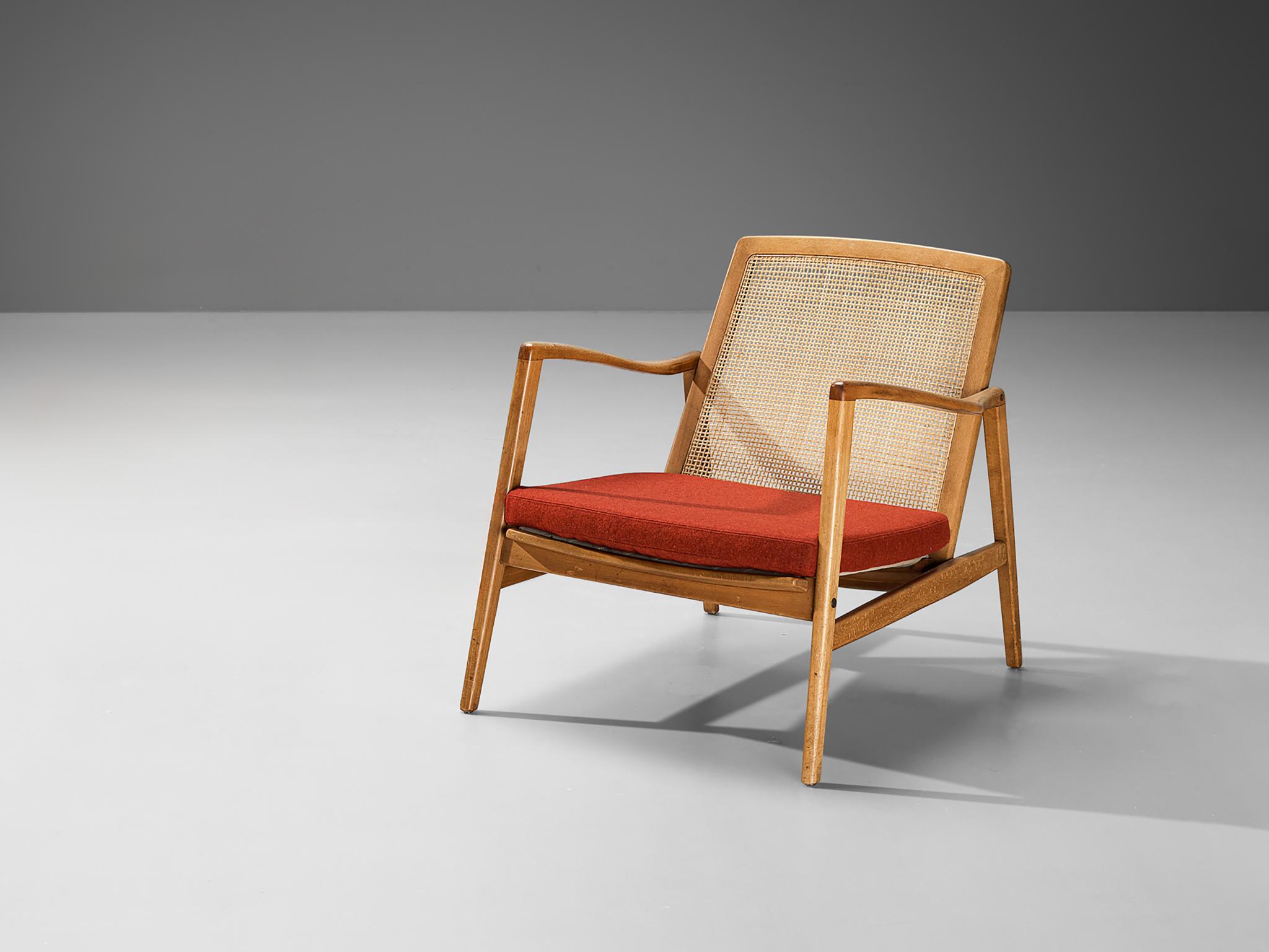 Hartmut Lohmeyer for Wilkhahn, lounge chair, walnut, beech, cane, fabric, Germany, 1956

This organic shaped lounge chair by Hartmut Lohmeyer showcase a wide open wooden frame with a gentle tilt in the back, adorned with cane. The softly curved