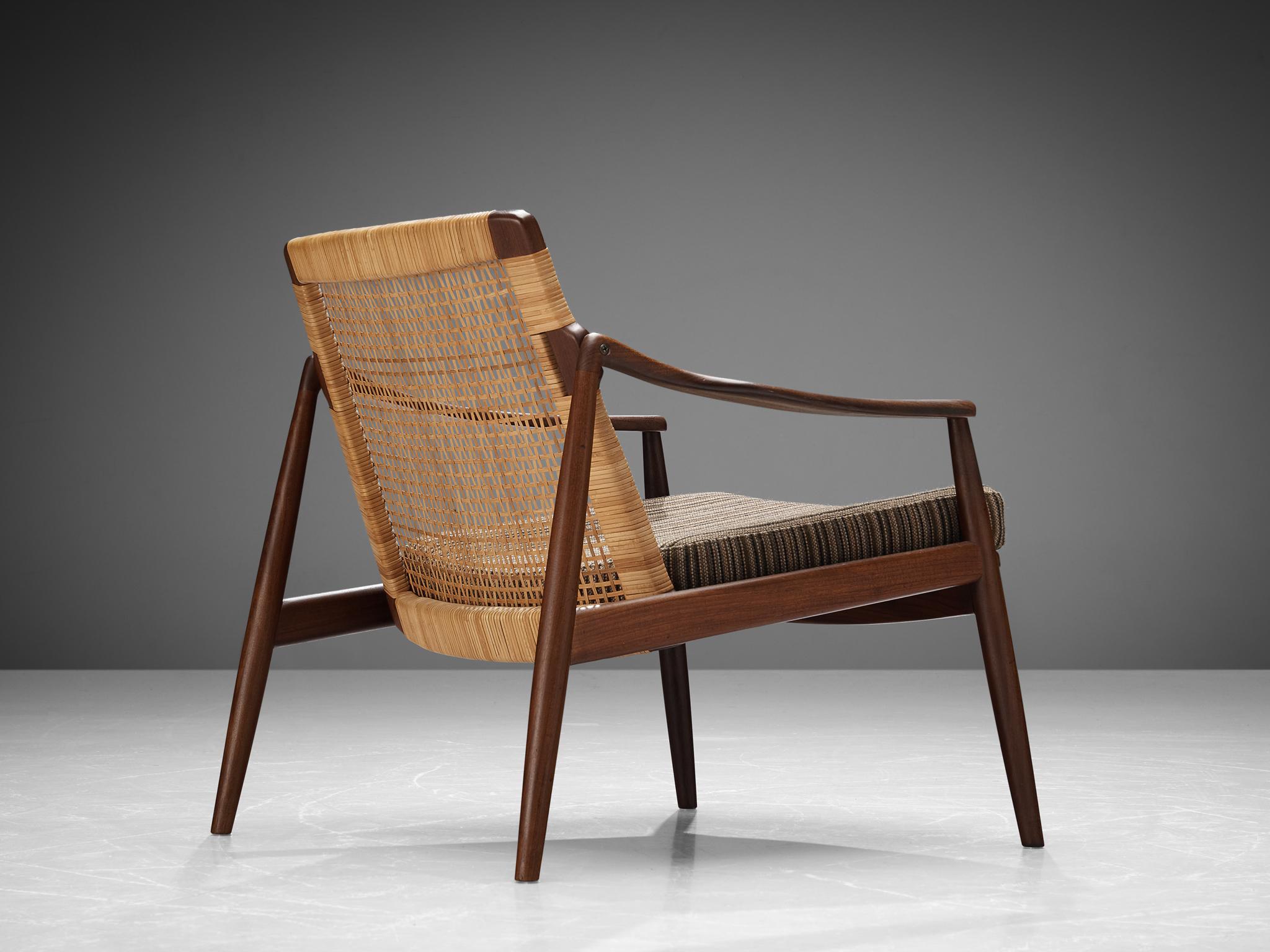 Hartmut Lohmeyer for Wilkhahn, lounge chair, teak, cane, fabric striped upholstery, Germany, 1960

The lounge chair by Hartmut Lohmeyer is organically shaped. The wide open teak frame features a slightly tilted back made out of cane. The softly