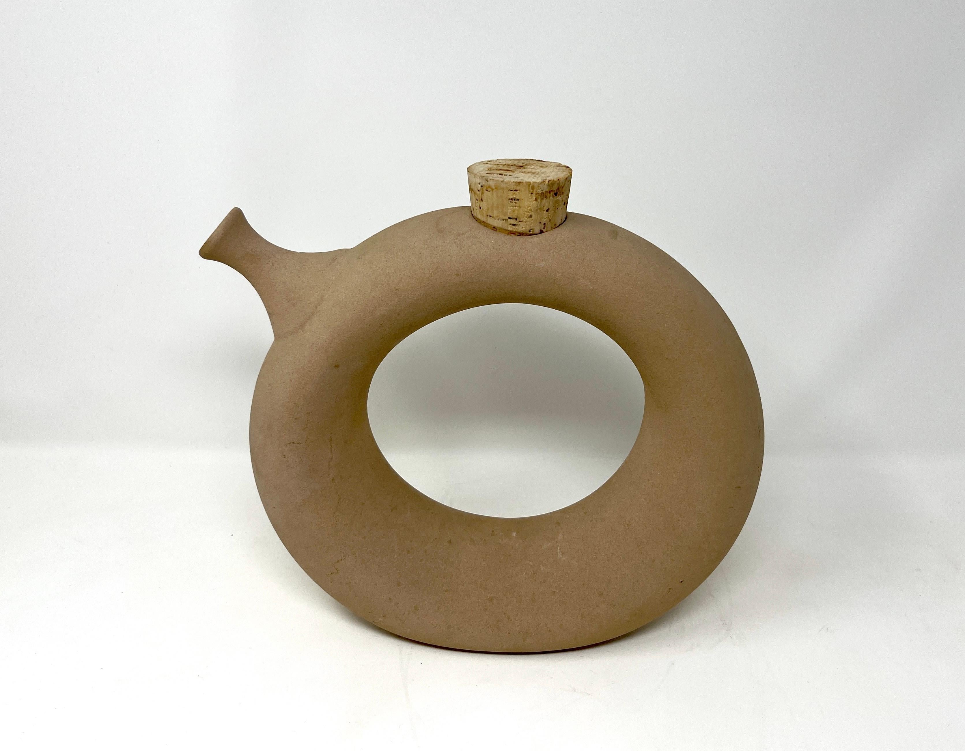 Classic hand-crafted ceramic Bohemian circular wine jug made and signed by Hartstone. Unglazed exterior and glazed interior for use as a wine decanter, water carafe, watering can or vase. Original tightly fitting cork. 

Crafted from high-quality
