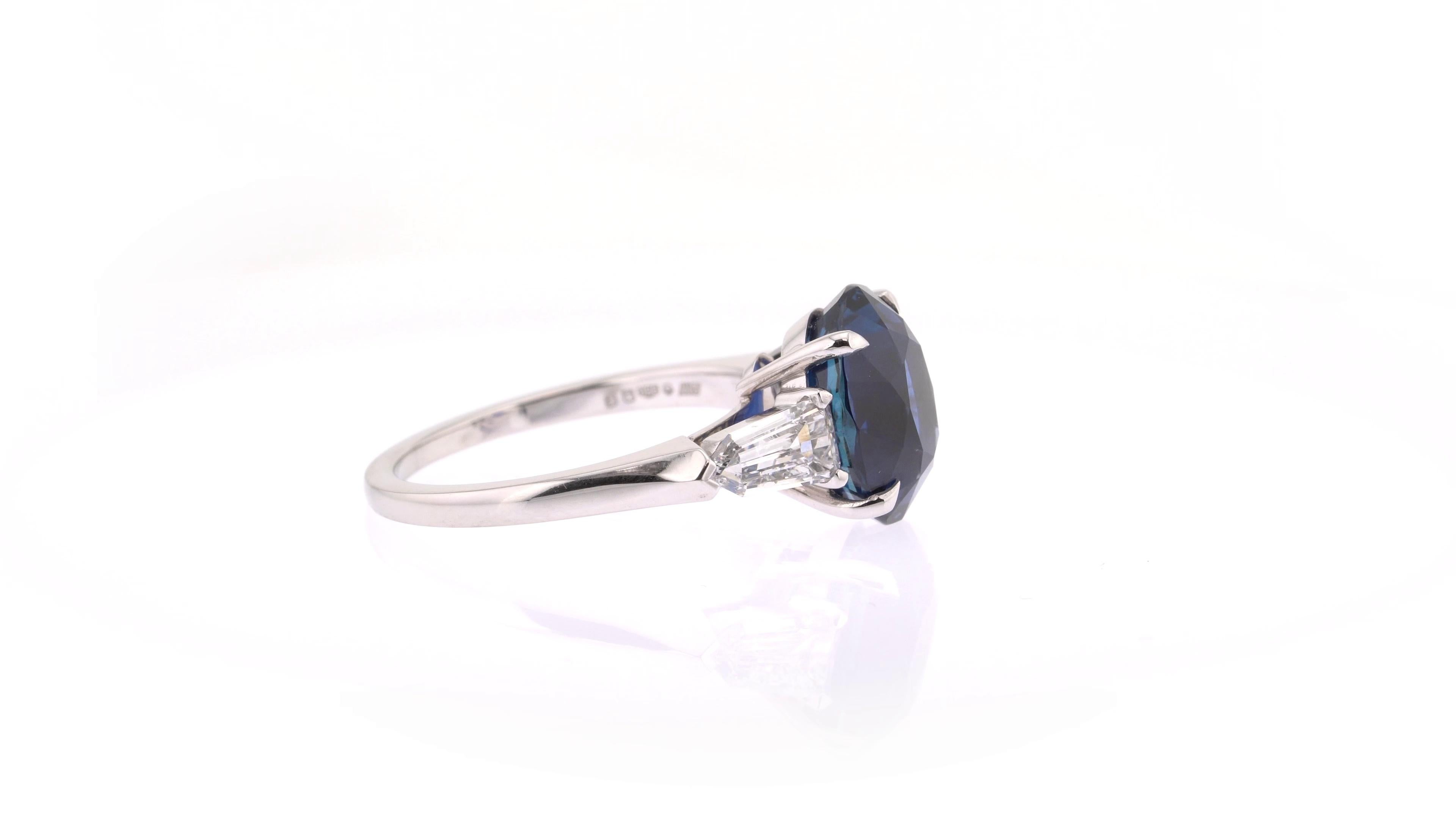 Contemporary GRS Certified 5.29 Carats Royal Blue Sapphire Three Stone Ring in Platinum For Sale