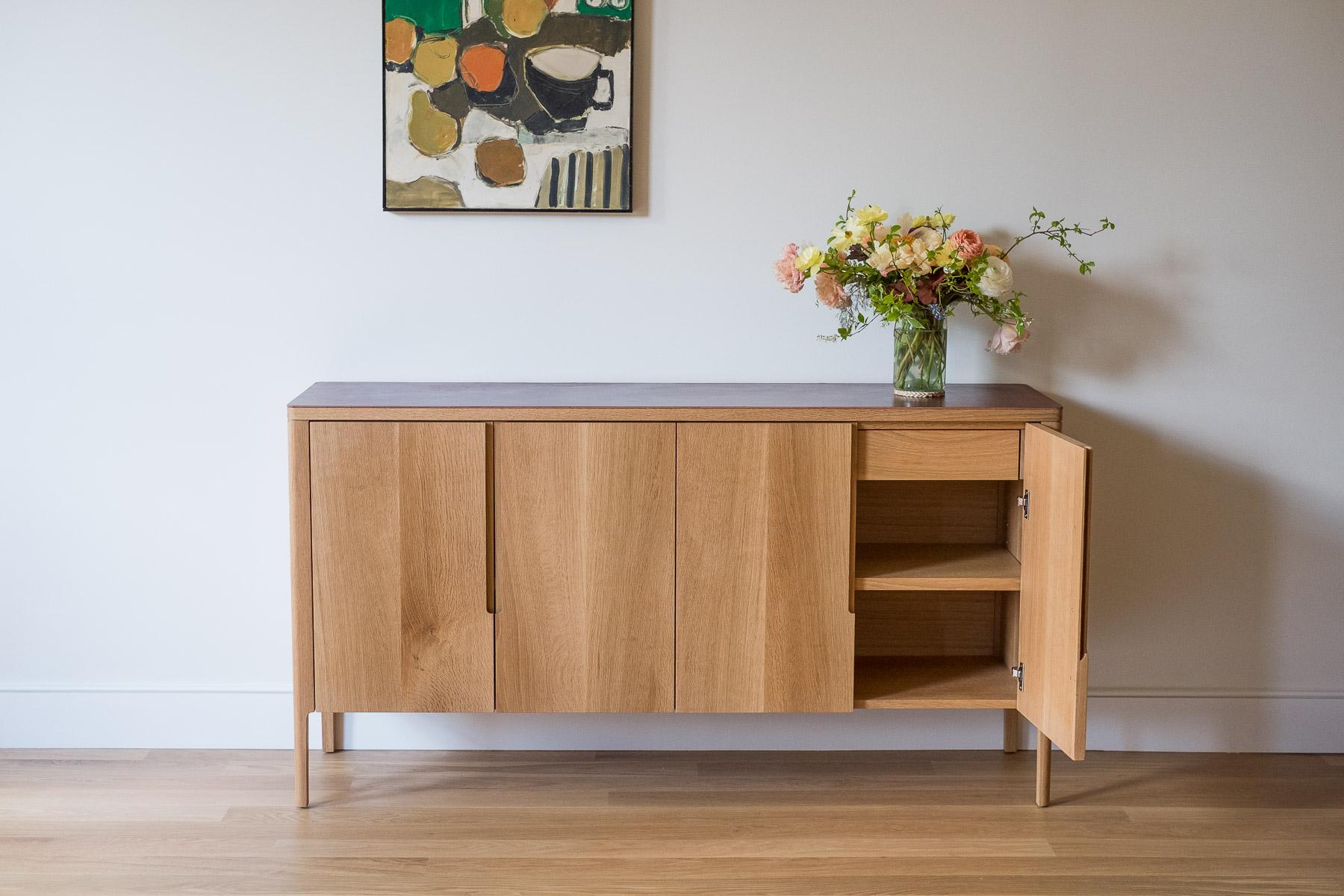 The Harvest Sideboard is designed to house glassware, spirits, and accoutrement. The front features hand-sawn veneered doors with integrated pulls. The top is clad in hand finished, full grain leather - a material chosen for it's natural beauty and