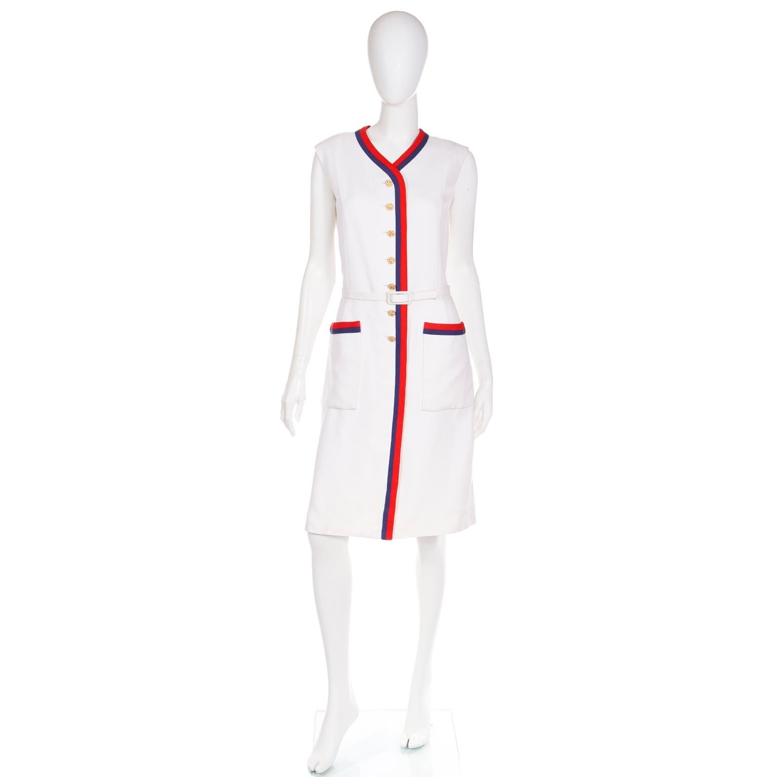 We love vintage Harvey Berin dresses designed by Karen Stark and this one is well made down to every detail. This late 1960's Summer day dress is in a white textured linen like fabric and it is fully lined in an ivory silk. The red and navy blue