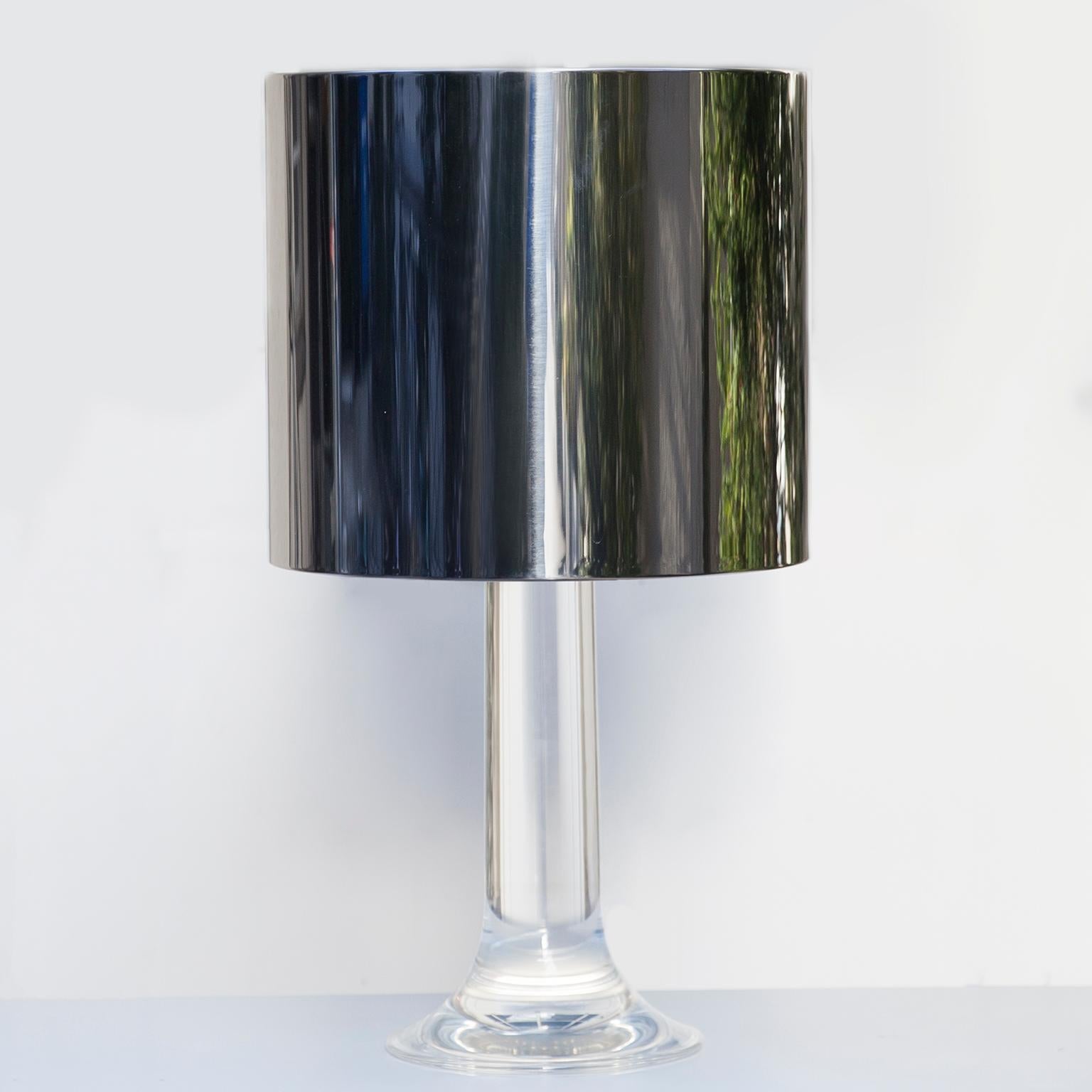 Italian table lamp by Harvey Guzzini, 1970. Lucite base and a polished steel shade. One-light above and three below. Fantastic light.