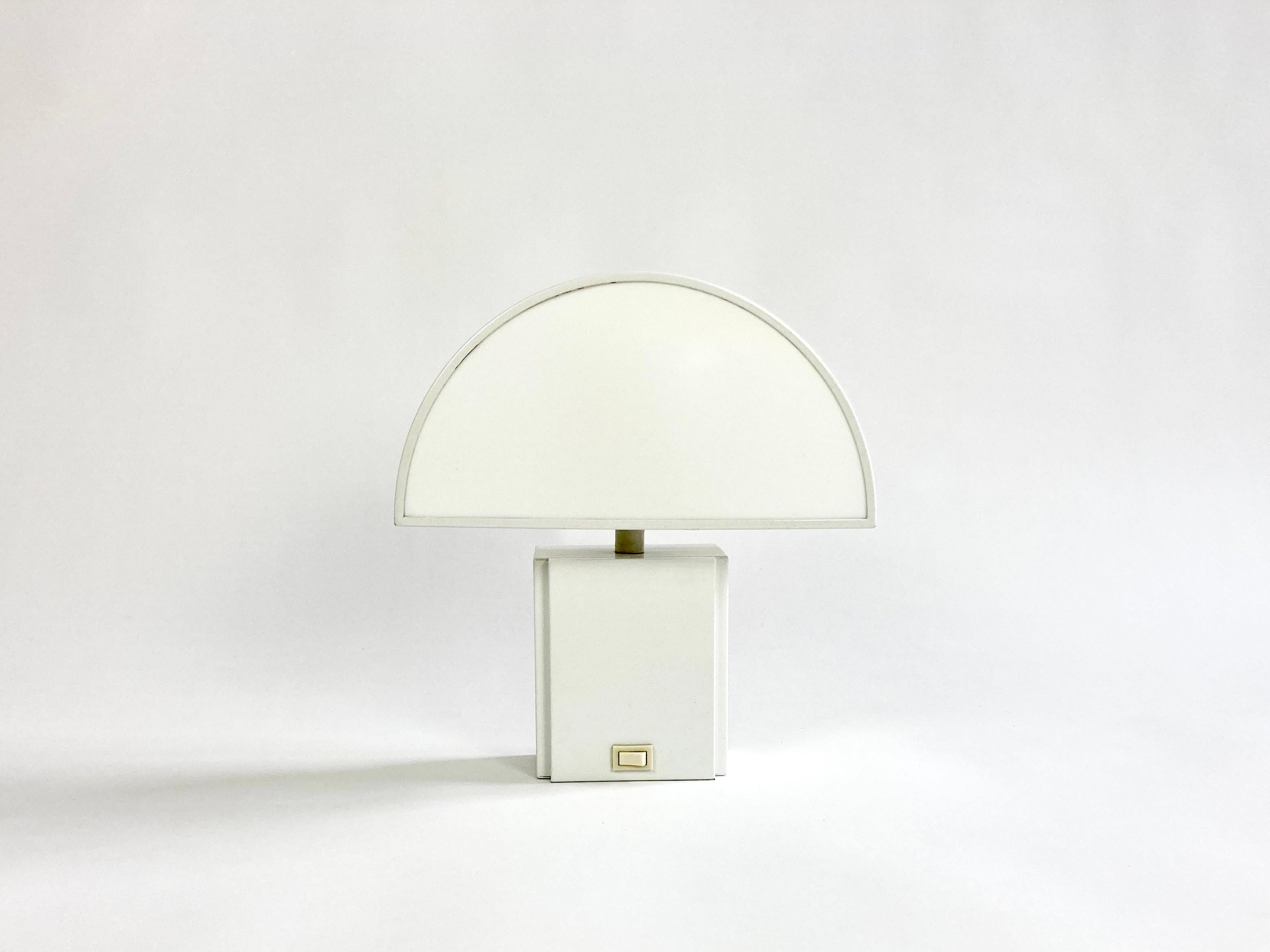 1970s Harvey Guzzini Olympe lamp.

This is the smallest lamp in the series designed by Harvey Guzzini in the 1970's and produced by ED.

Can be used as a wall or table lamp.

The lamp is an elegant geometric shape with opaque plastic that
