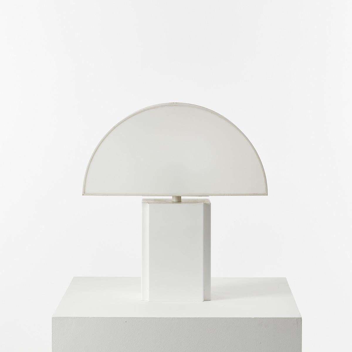 Large Olympe table lamp designed by Harvey Guzzini for ED, Italy 1970s. The demilune shade is particularly pleasing lit, a half moon of ambient light through semi-opaque acrylic. It has a metal base and a plastic shade, open at the back for ease of