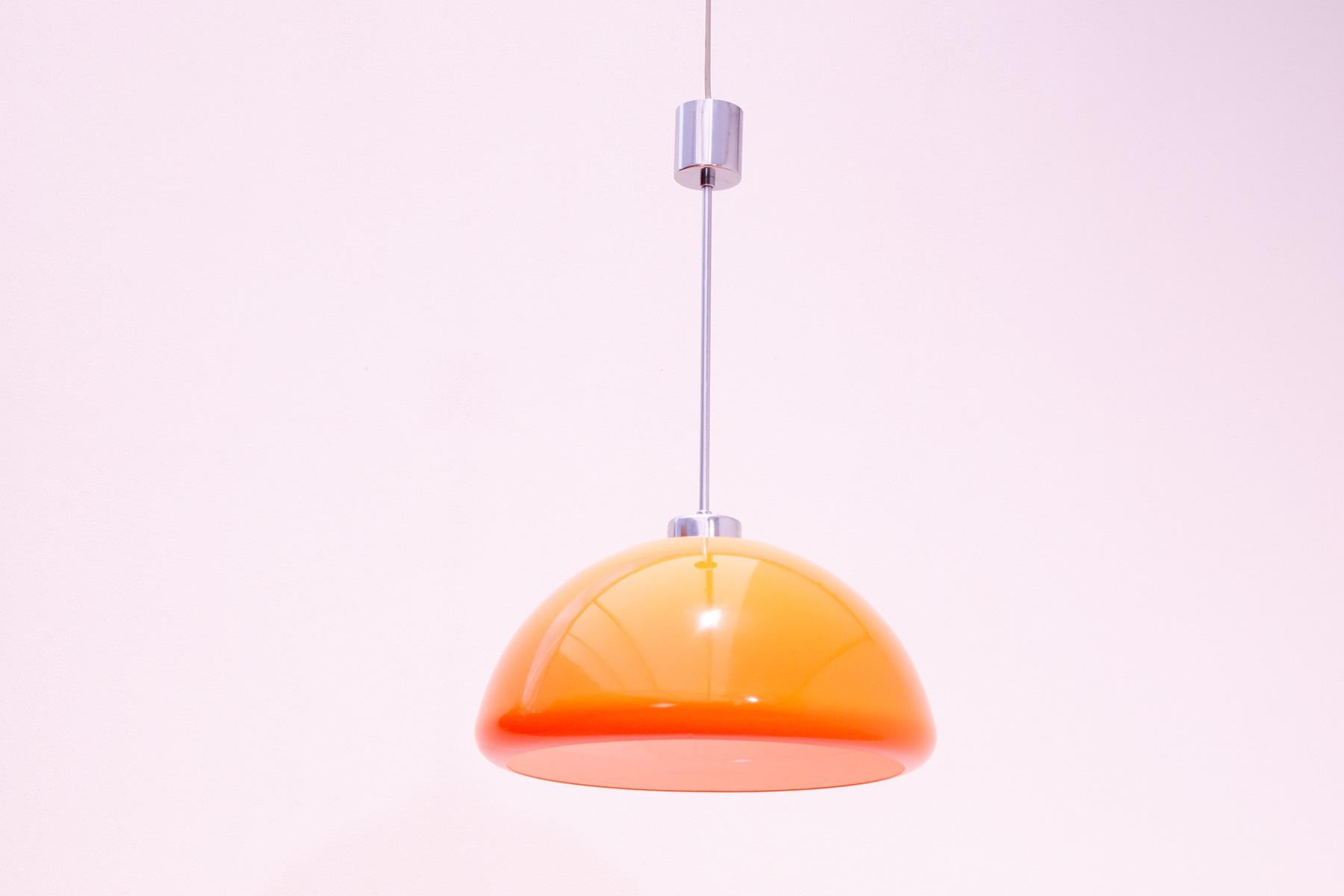 Harvey Guzzini Space-age pendant lamp, circa late early 1970s. It was produced by Meplo company. Signed on the shade.
In good working order and in very good condition. The plastic shade has no damage, is bright and clean, the chrome is in good