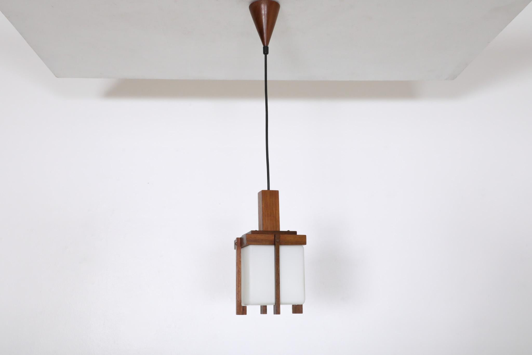 Danish Harvey Guzzini style Mid-Century Teak Lantern Pendant with Milk Glass Shade For Sale