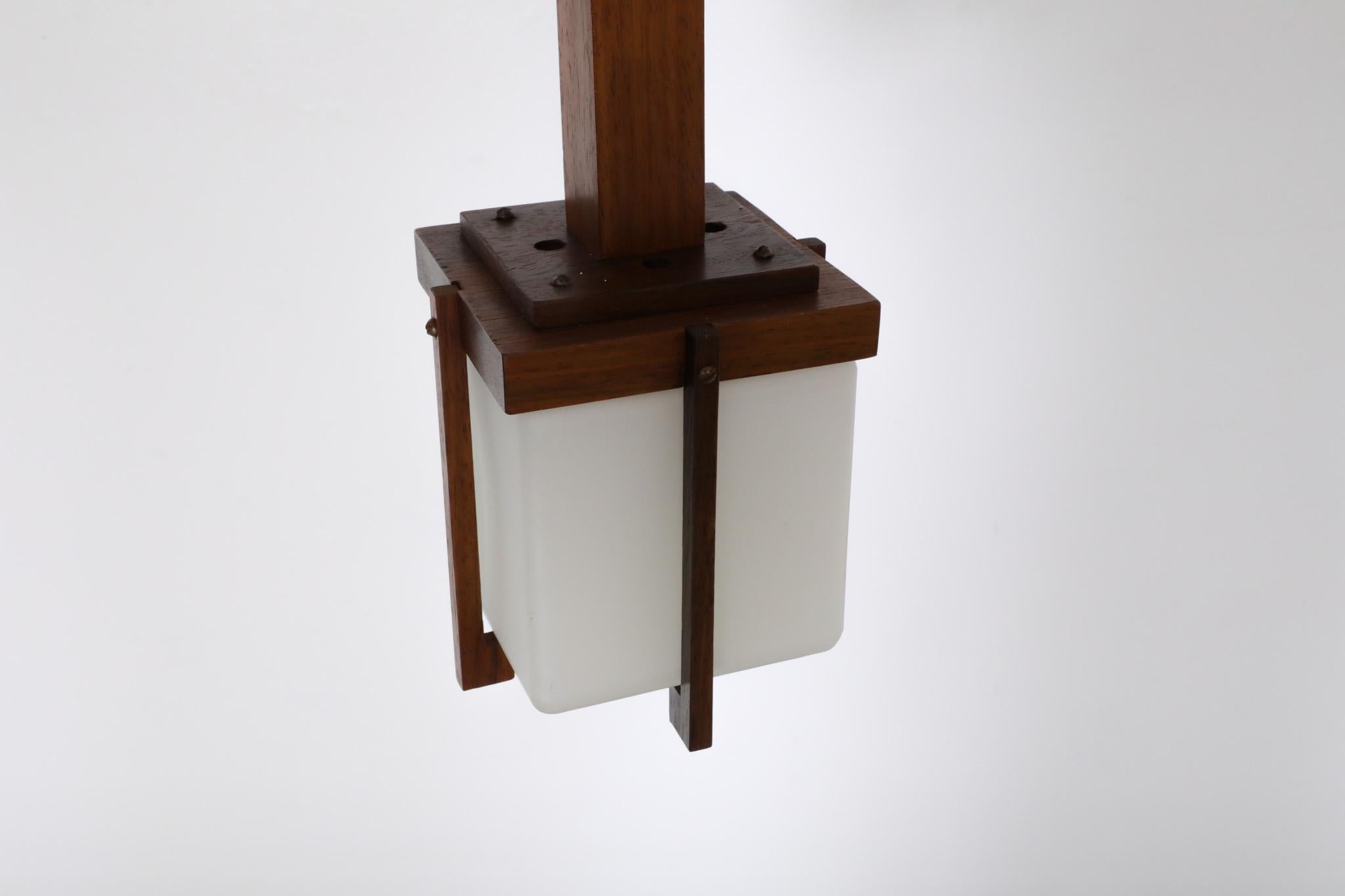 Harvey Guzzini style Mid-Century Teak Lantern Pendant with Milk Glass Shade In Good Condition For Sale In Los Angeles, CA