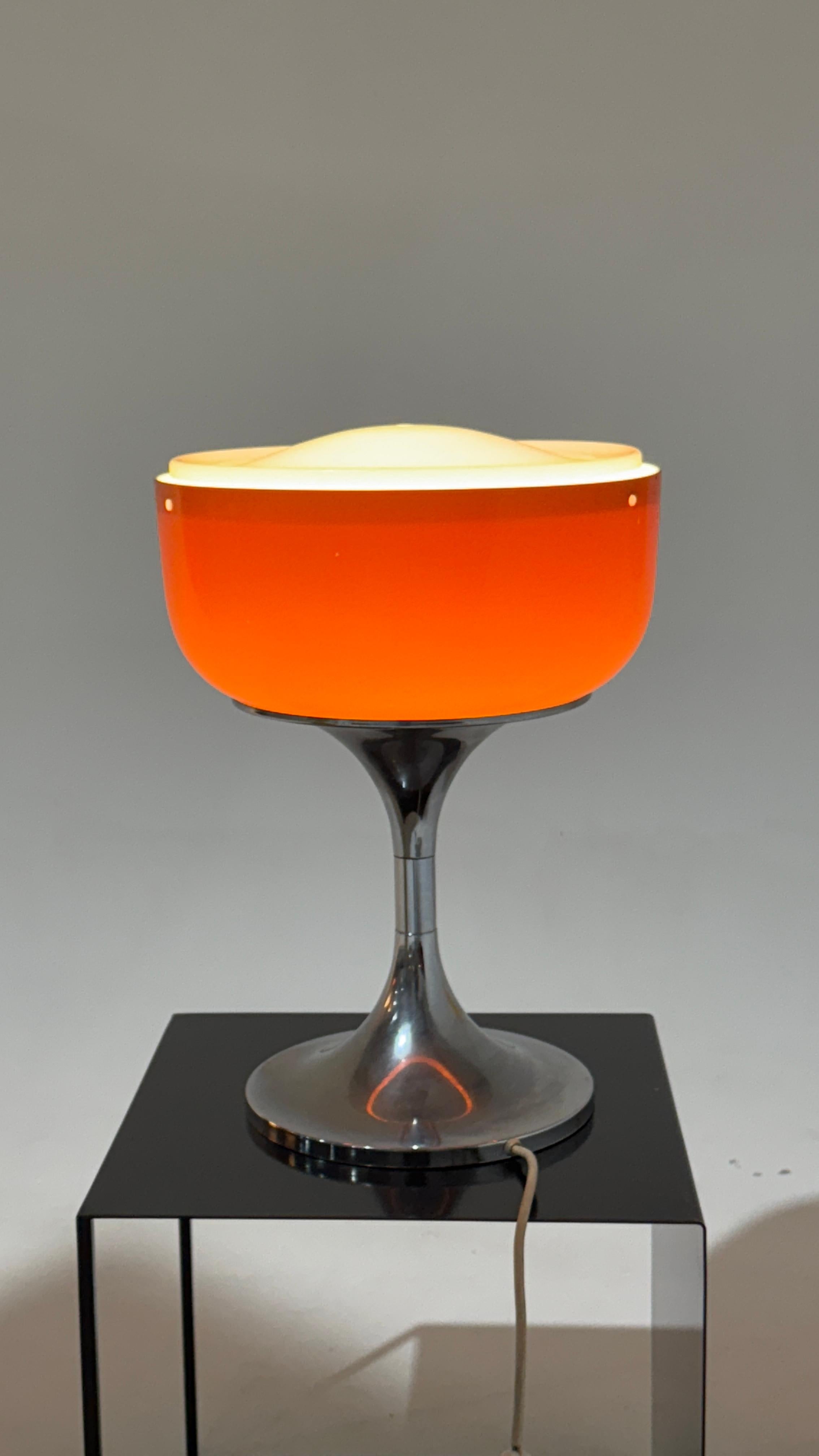 The Harvey Guzzini Sunrice table lamp, designed by Luigi Massoni, is an iconic example of Italian design from the 1970s. With its distinctive diffused light and elegant shapes, this lamp brings warmth and sophistication to any space.

Height: 48