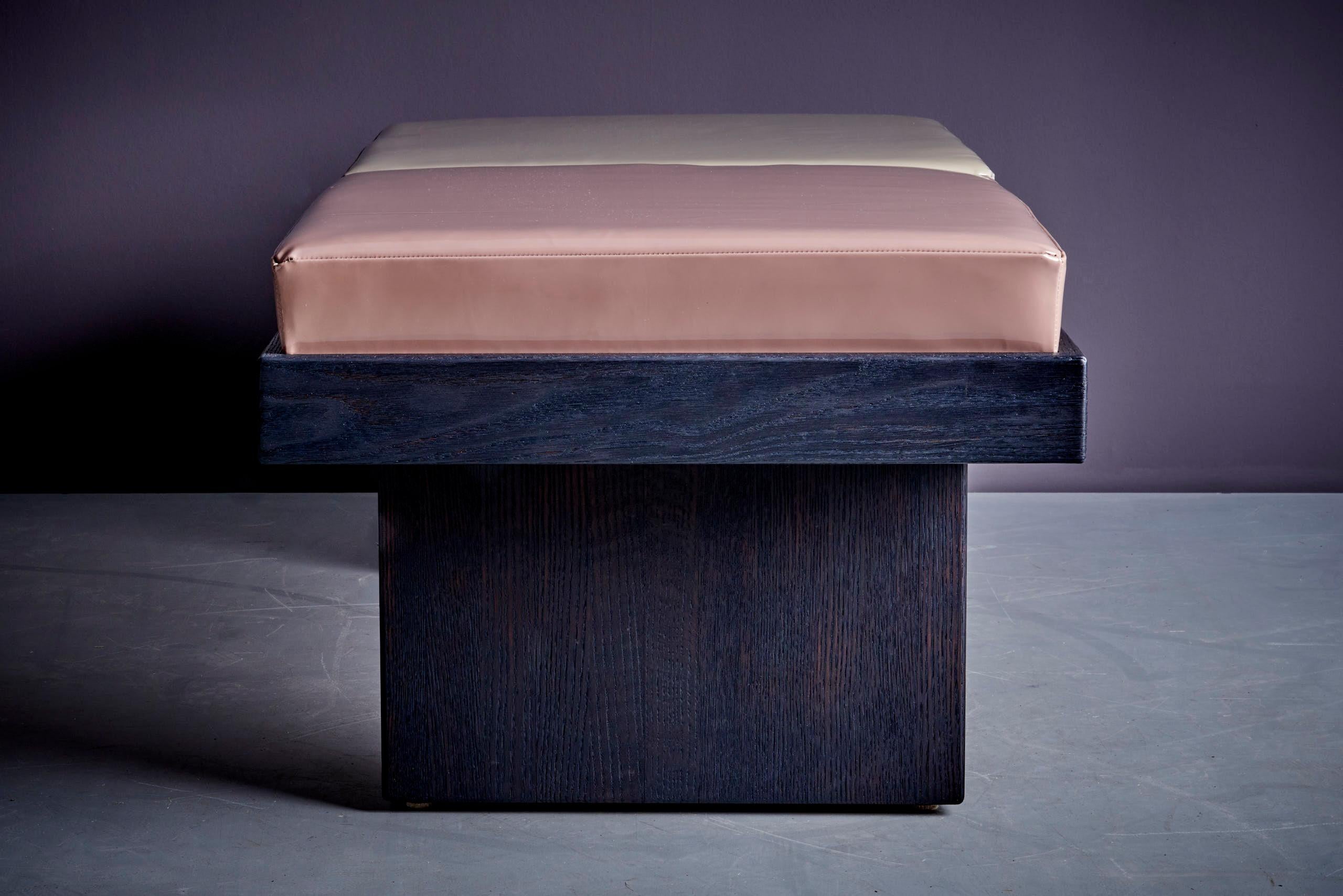 A two-seater bench, originally designed by Harvey Probber, has been redesigned by Michael Michalsky upholstered with patented leather (vernice leather) by La Gazarara. The wooden frame was treated using the Yakisugi method, a Japanese technique that