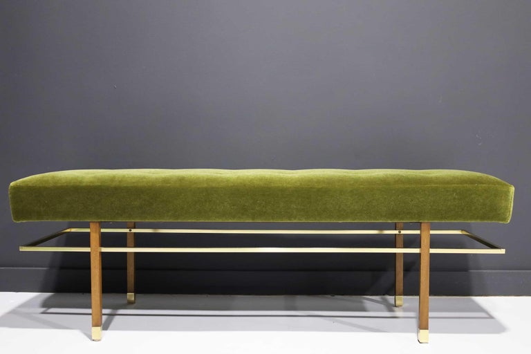 Fully restored an iconic bench by Harvey Probber. Floating brass stretcher and brass sabots have been polished to their original luster. Mahogany wood frame and a plush mohair fabric.
