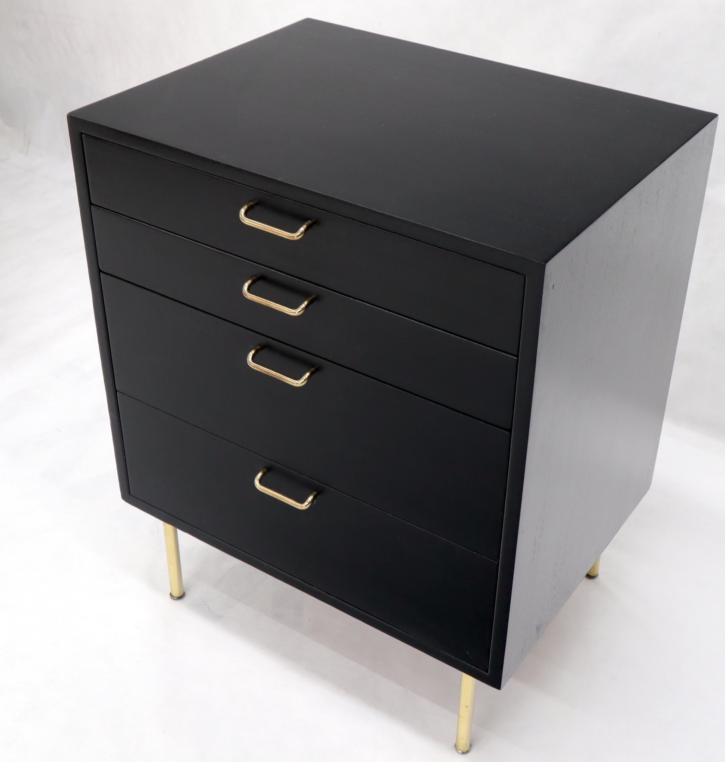 black dresser with brass hardware