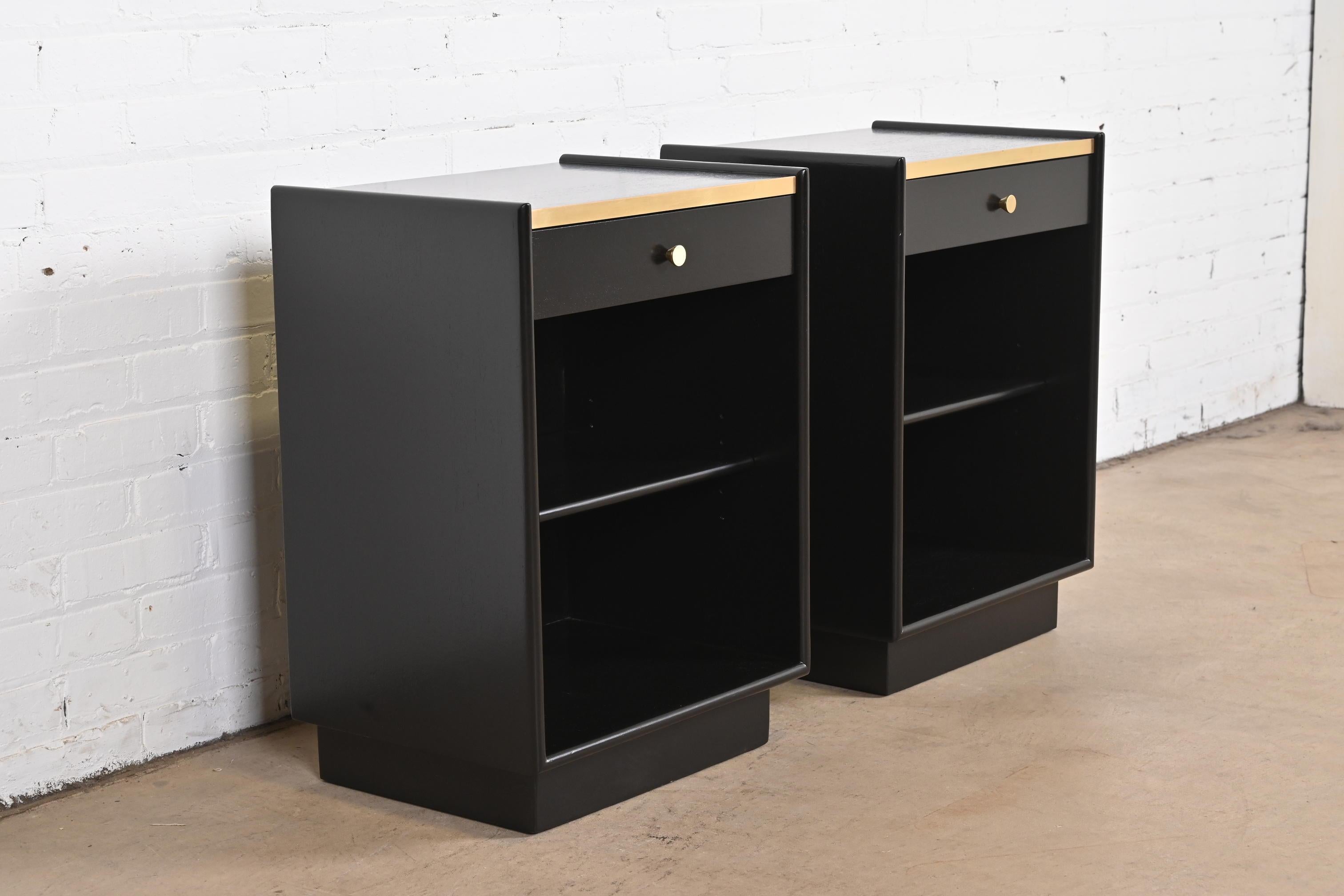 An exceptional pair of Mid-Century Modern nightstands

By Harvey Probber

USA, 1960s

Black lacquered mahogany, with original brass trim and hardware.

Measures: 19