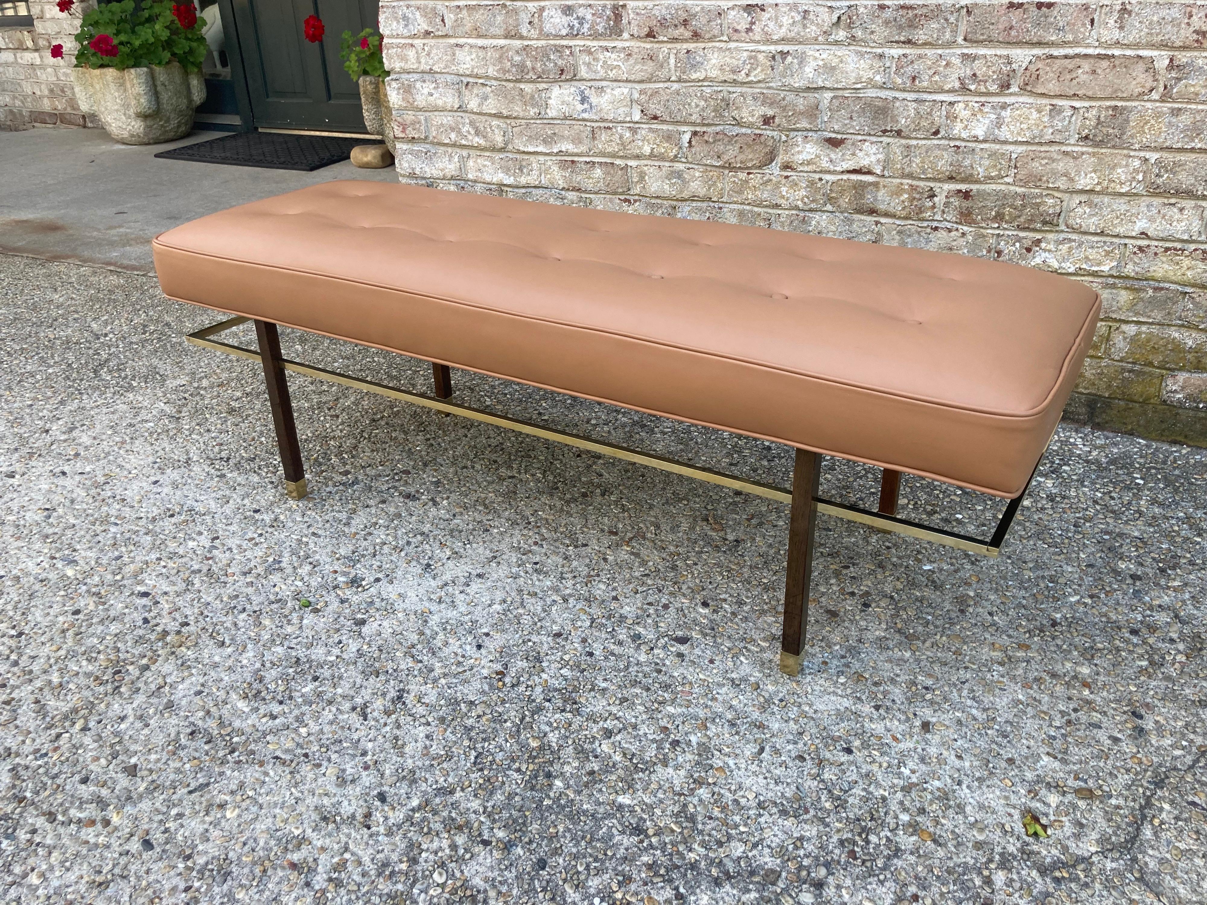 Harvey Probber brass and wood frame bench upholstered in camel colored leather... elegant brass sabots and stretcher..... circa 1950....